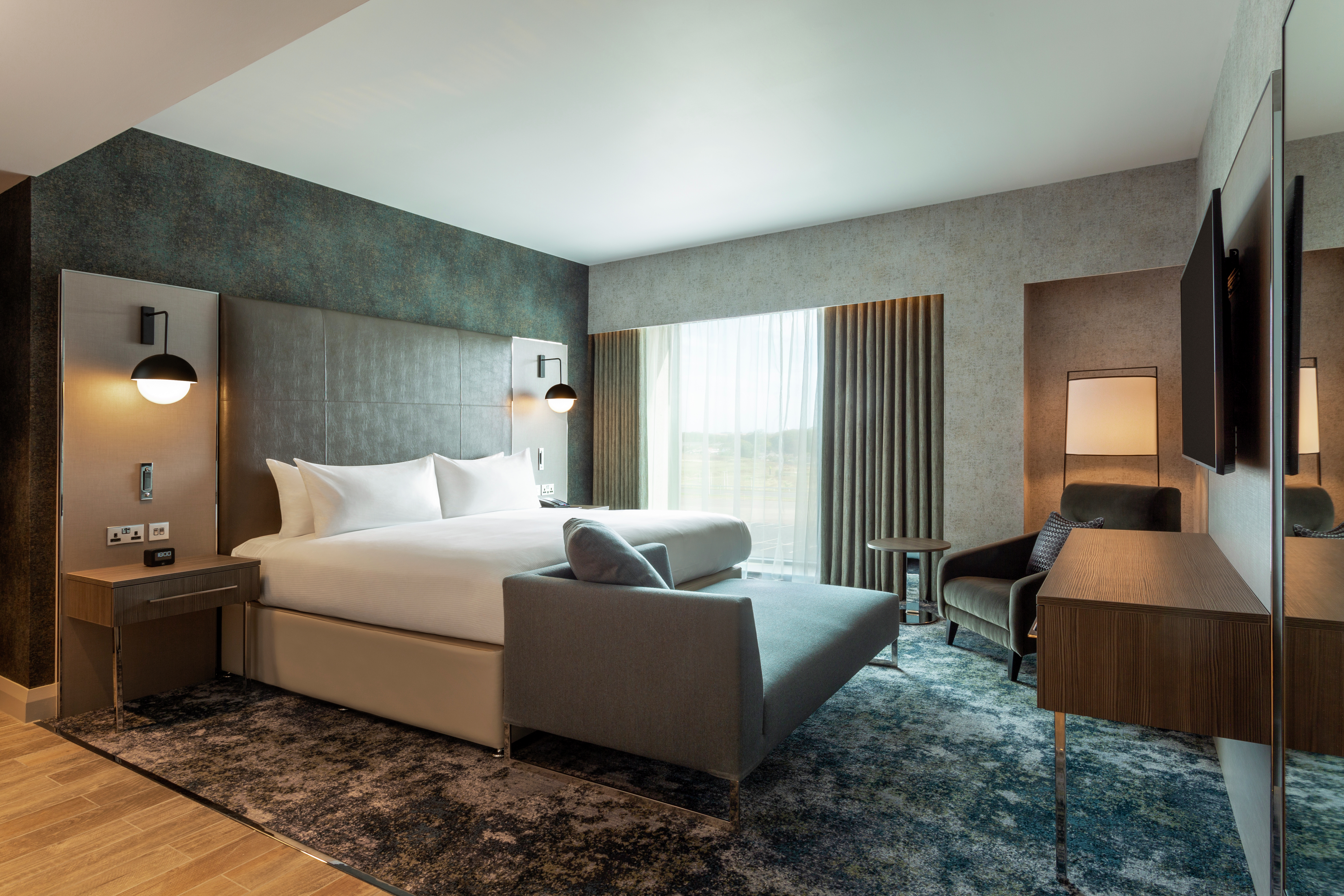 Suite Bedroom with HDTV Sofa and Soft Chair