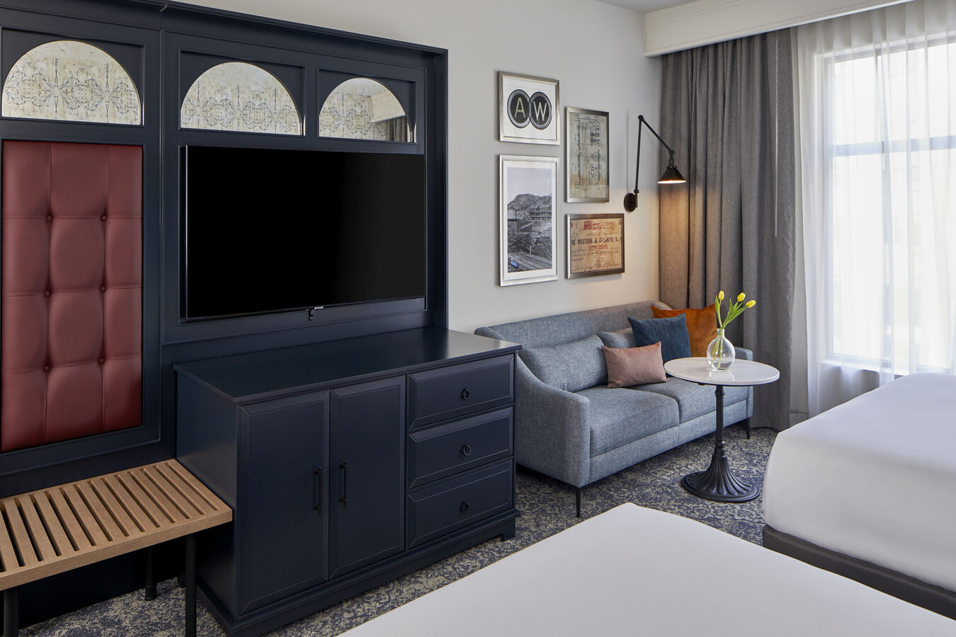 Guestroom with Two Queen Beds,TV and Sofa