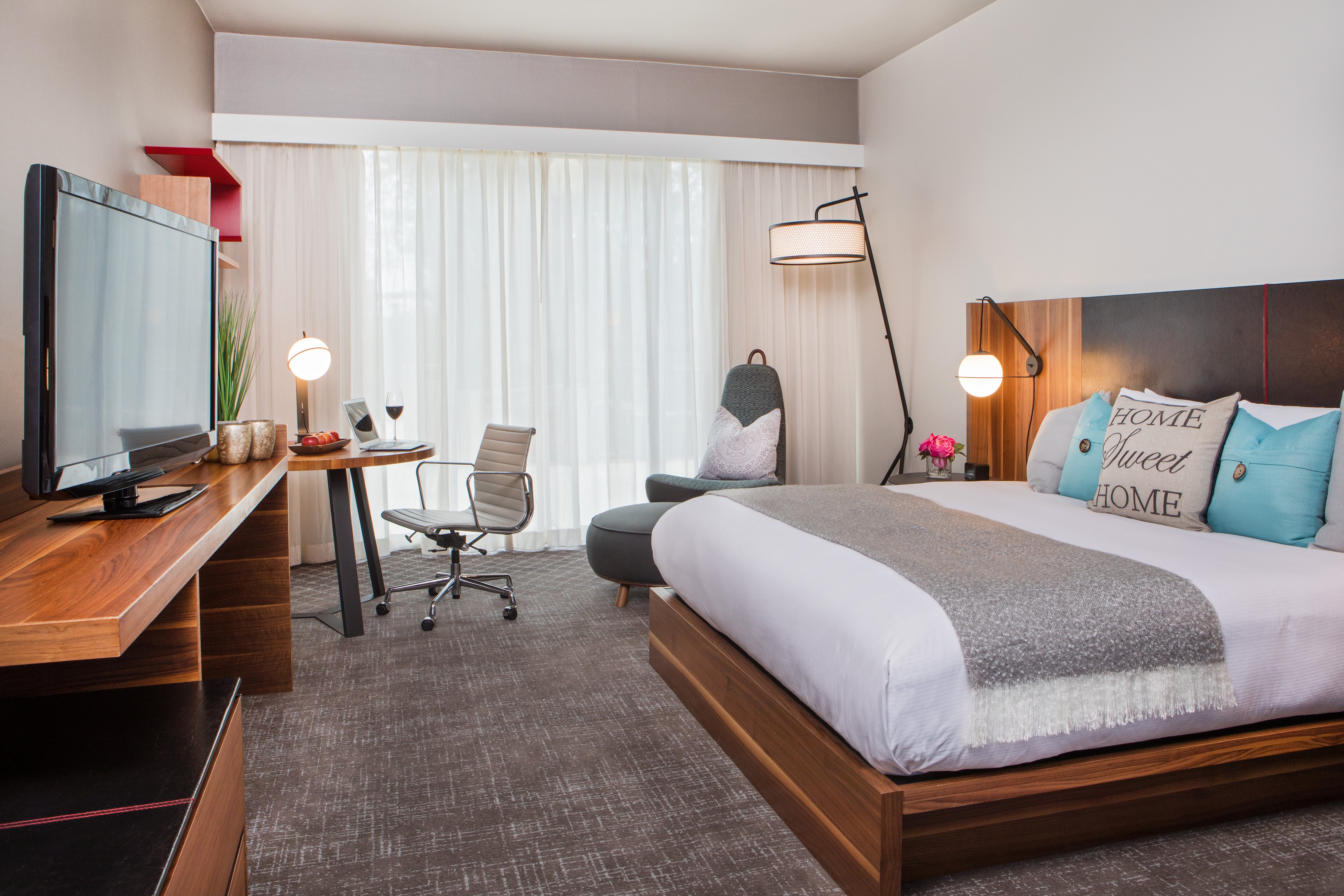 Guestroom with King Bed, Lounge Chair, Work Desk, and Television