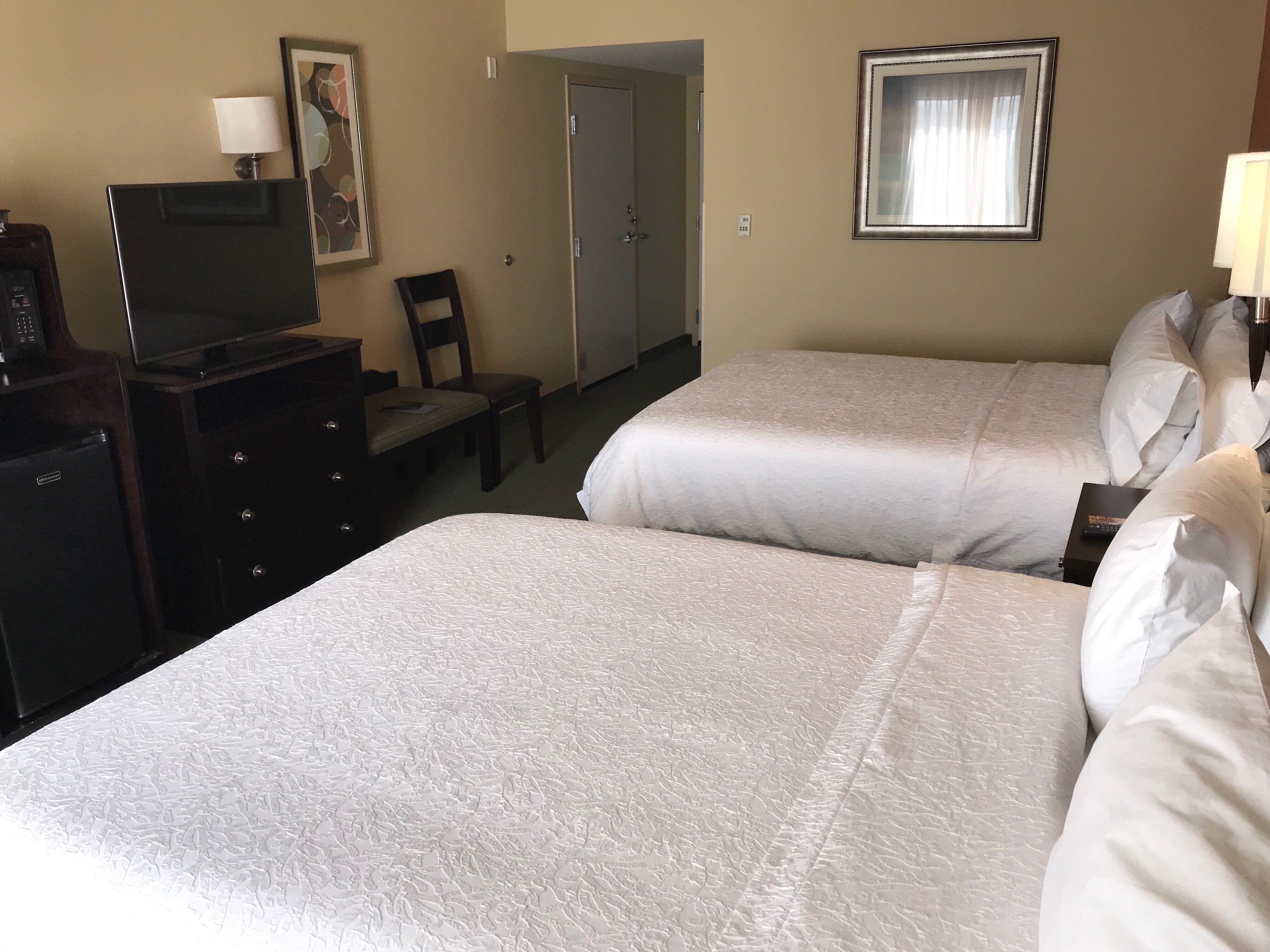 Guestroom with Two Queen Beds, Television and Mini Fridge