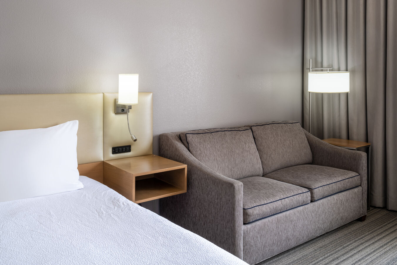guest room night table, lamp and sofa