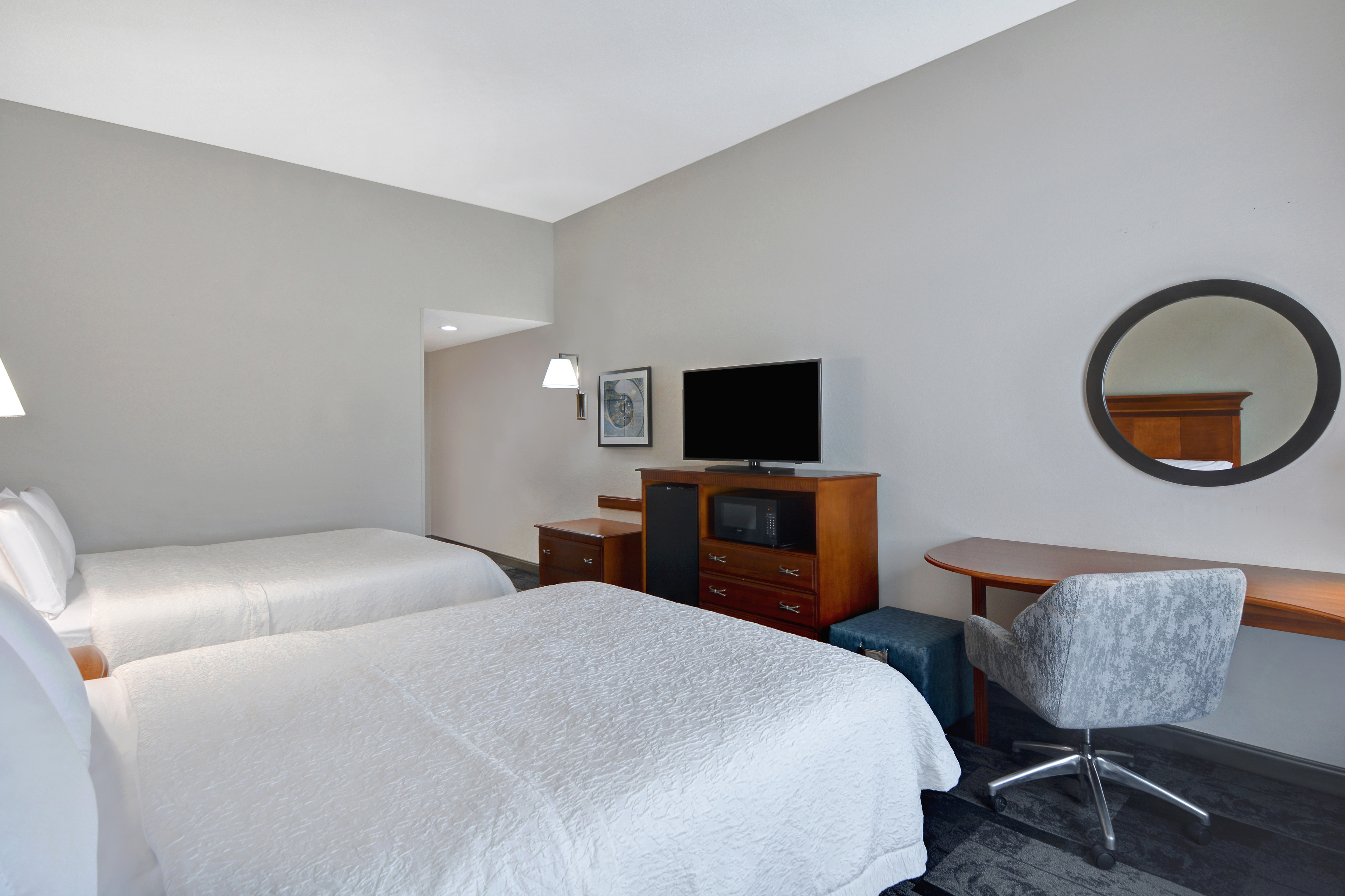 Guest Room with Two Beds Microwave Minifridge Desk and HDTV