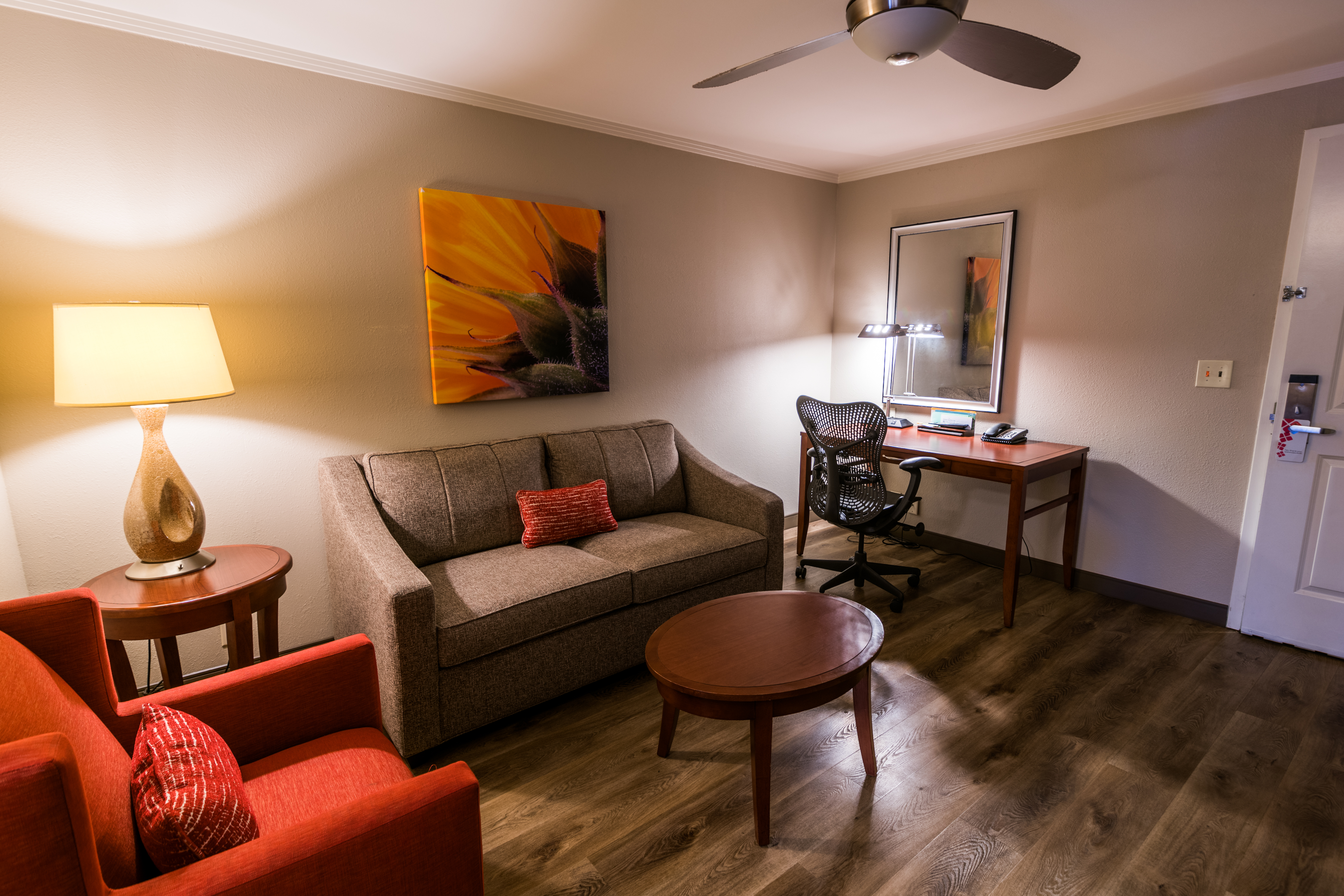 Guest Suite Lounge Area with Sofa, Armchair, Coffee Table and Work Desk
