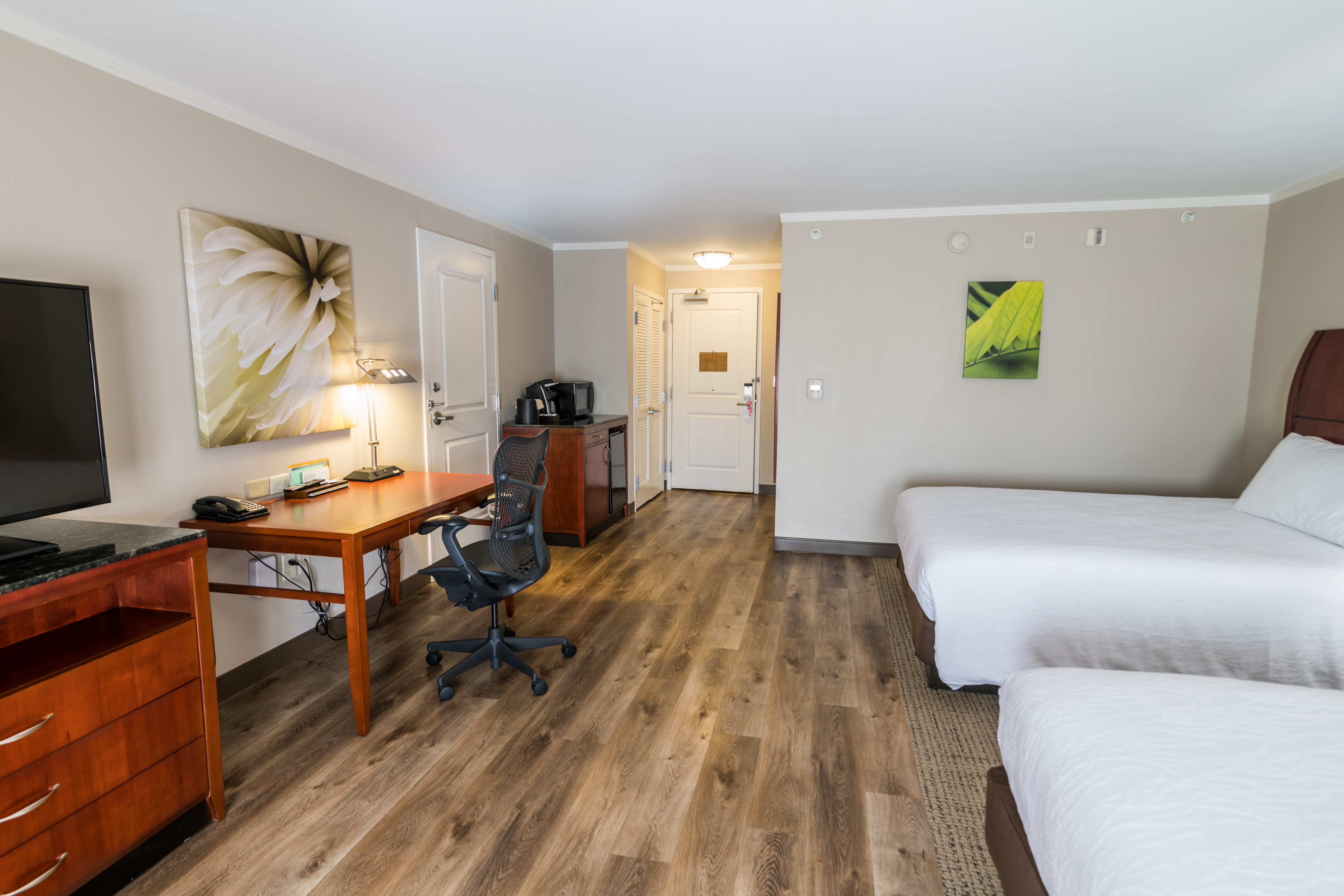 Guest Room With Two Queen Beds, Desk, Chair, Microwave, and Mini-Refrigerator