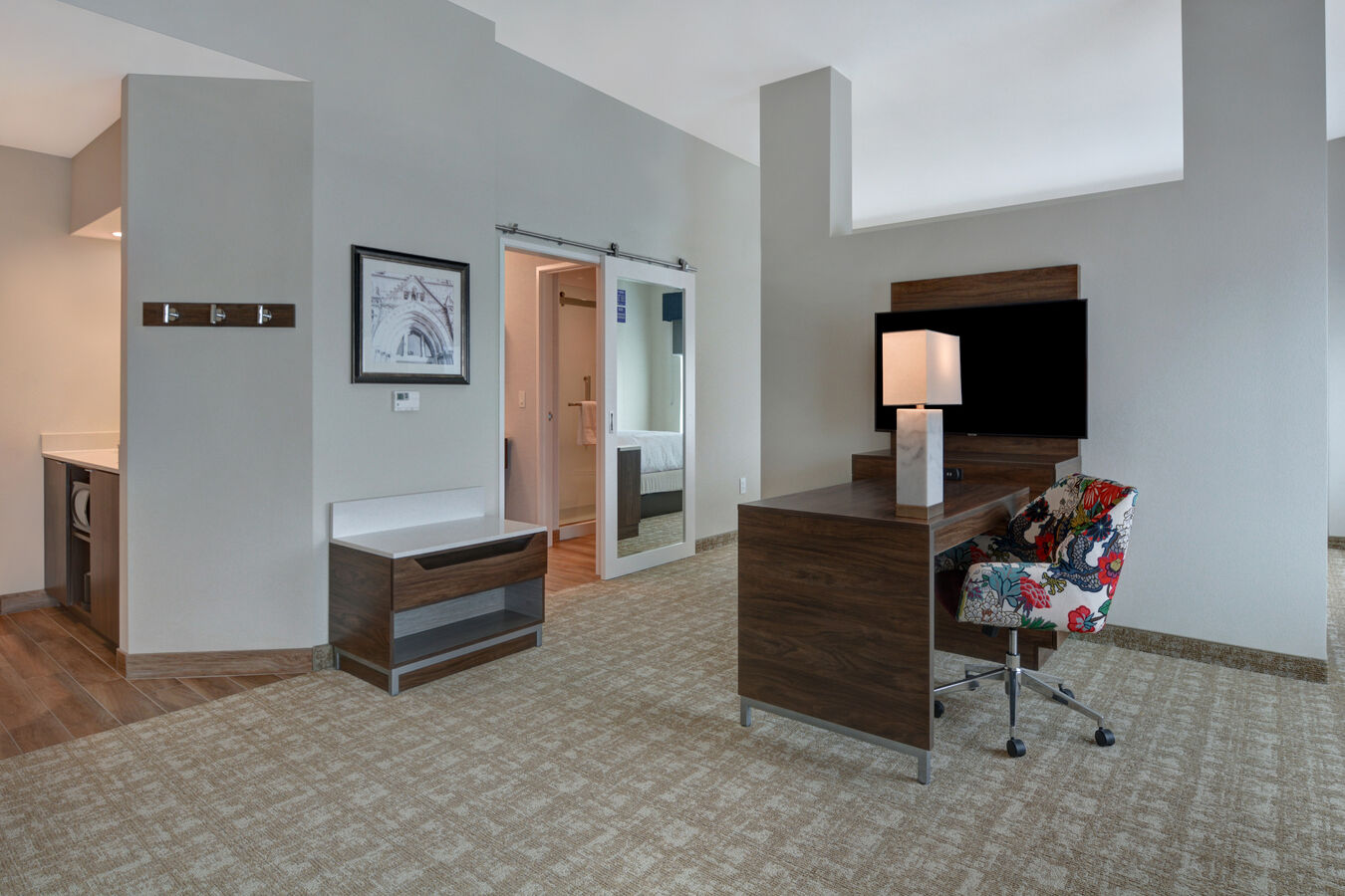 guest room with work desk and television