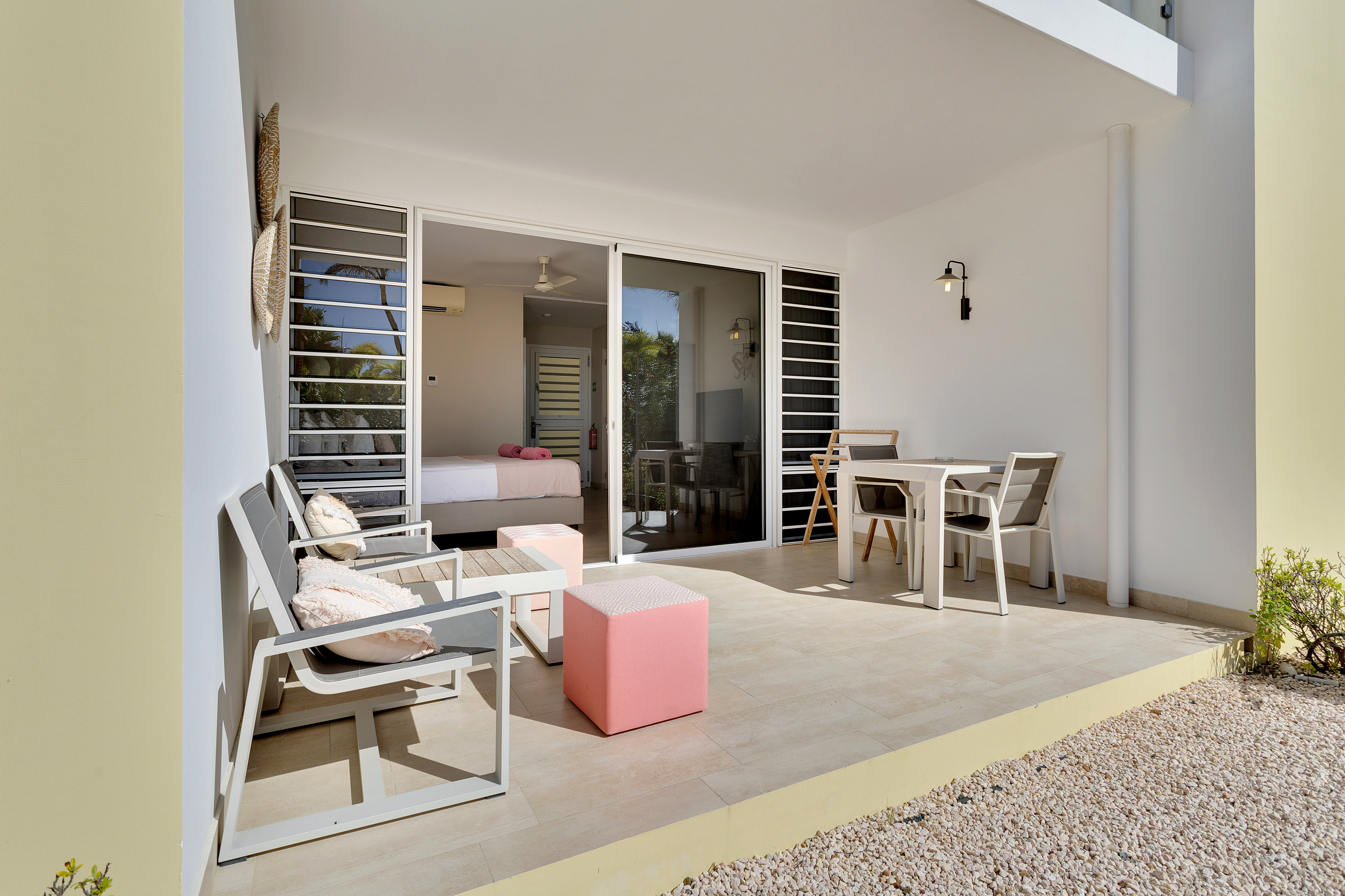 Guest room balcony with tables and chairs