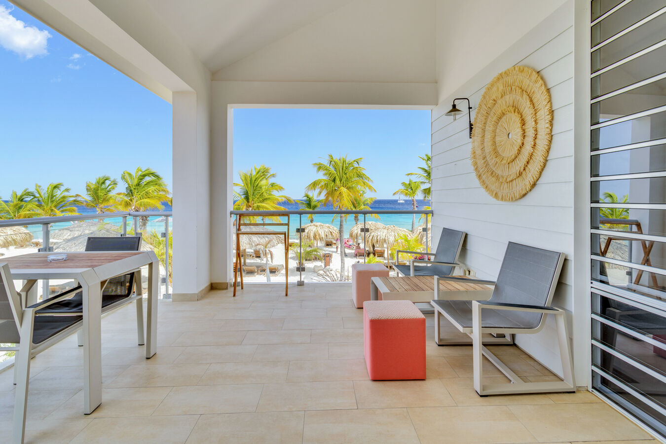 Guest room balcony with tables and chairs