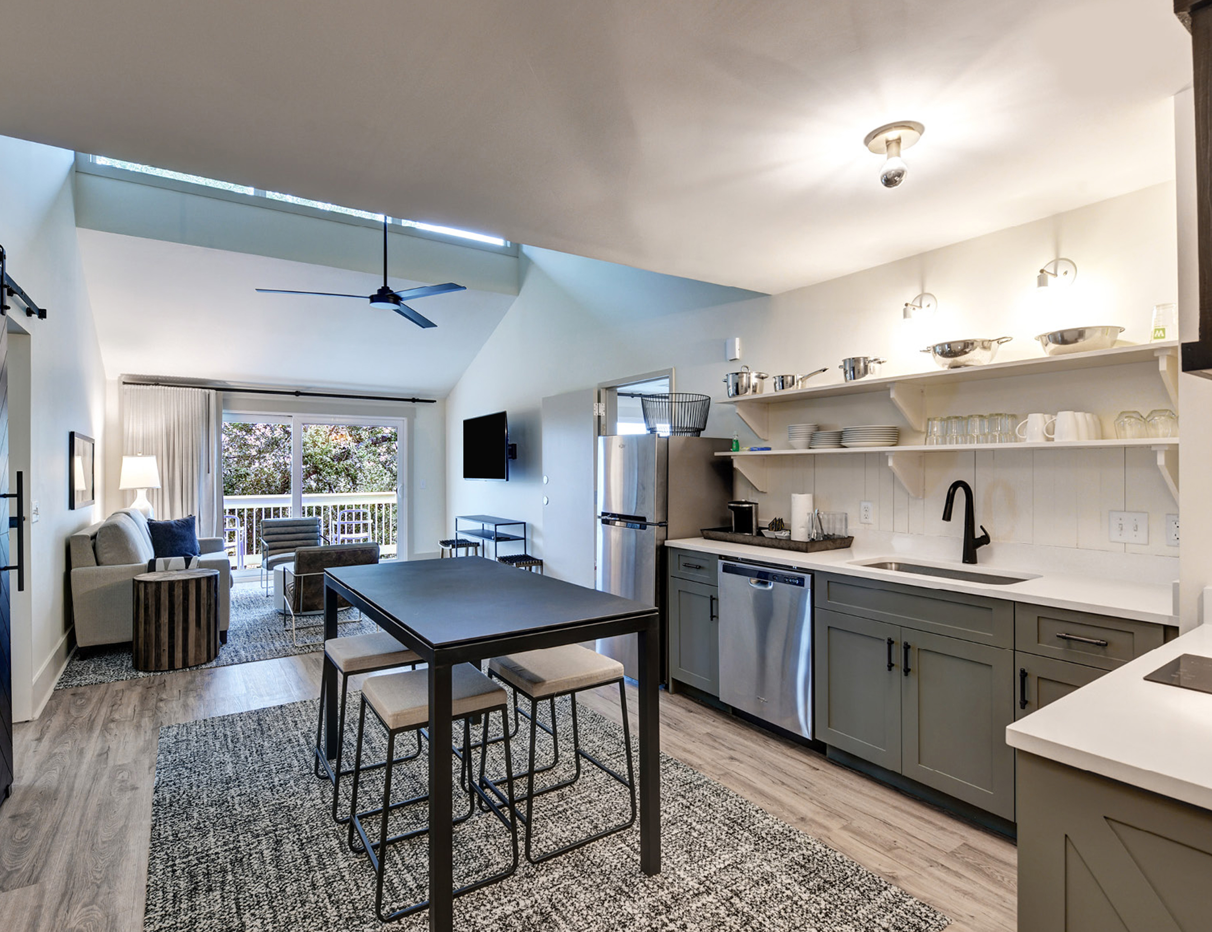 Kitchen, Dining and Living Area in a Guest Room with Balcony