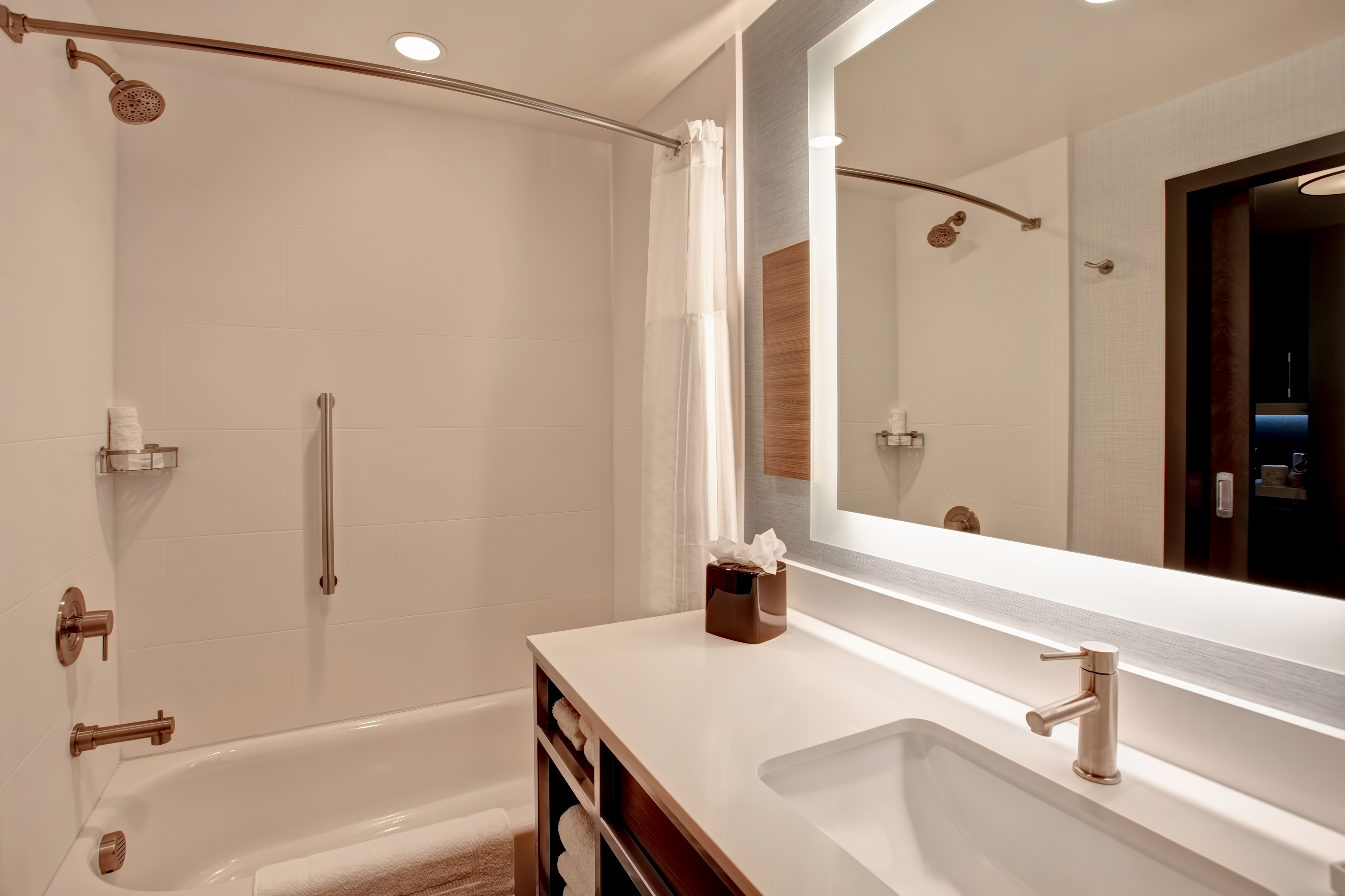 guest bathroom showing vanity and tub