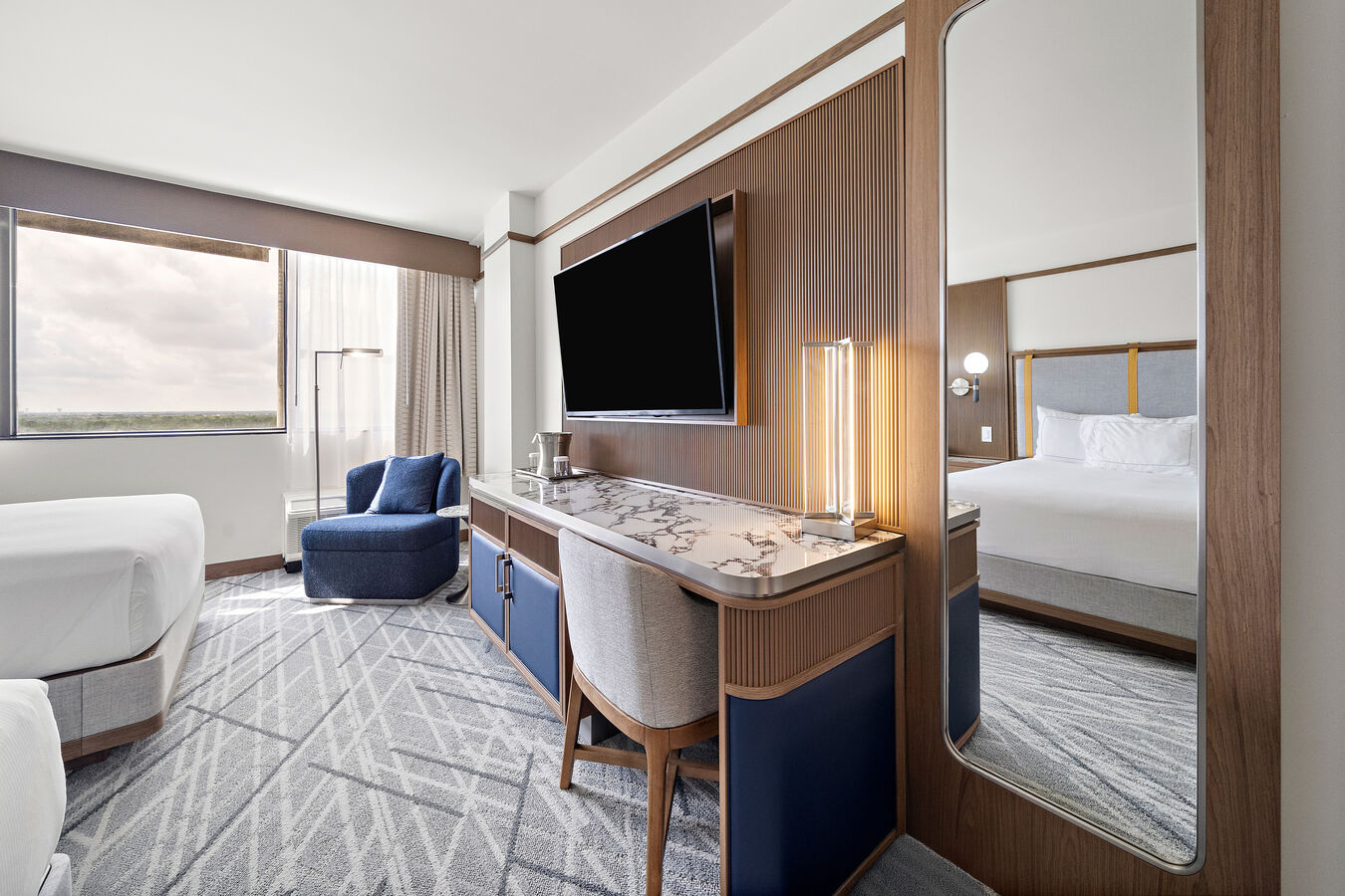 Queen Double Bedroom with Work Desk, Chair, Wall TV, and Sofa Chair