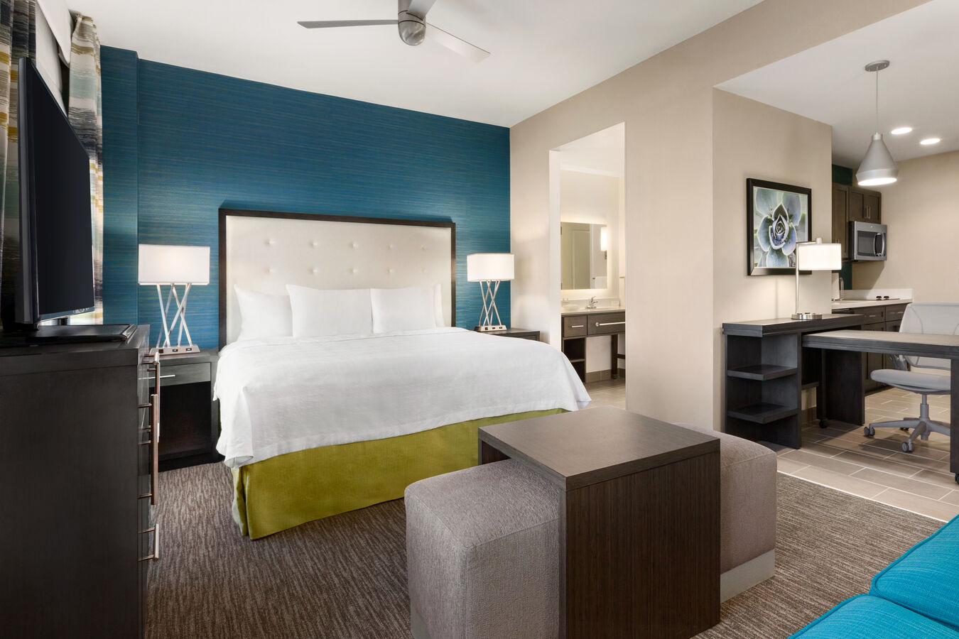 One King Bed Guest Bedroom with Work Desk, HDTV, Coffee Table and Sofa