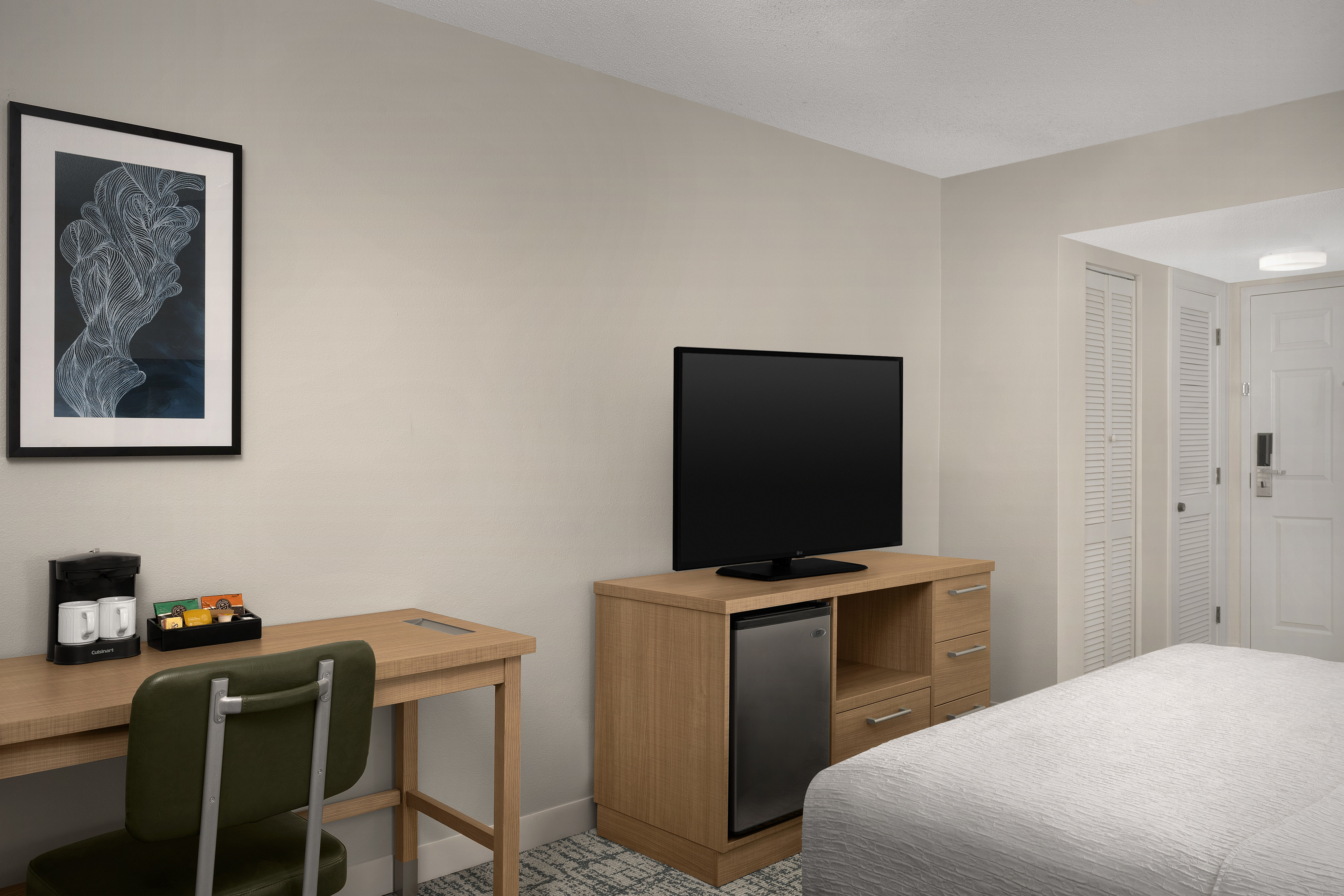 Work desk and TV in studio suite.