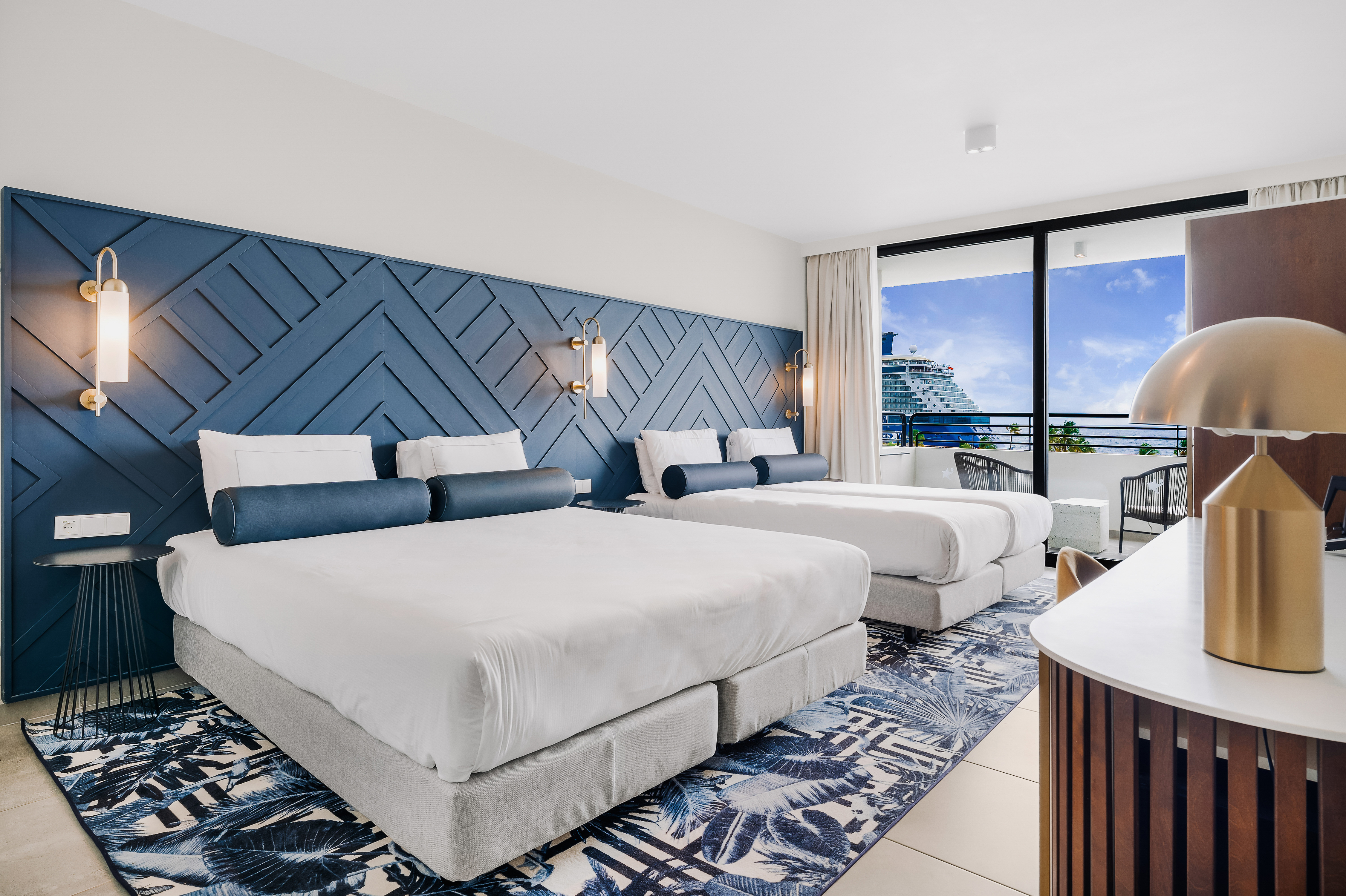 King and Two Single beds with view of outside