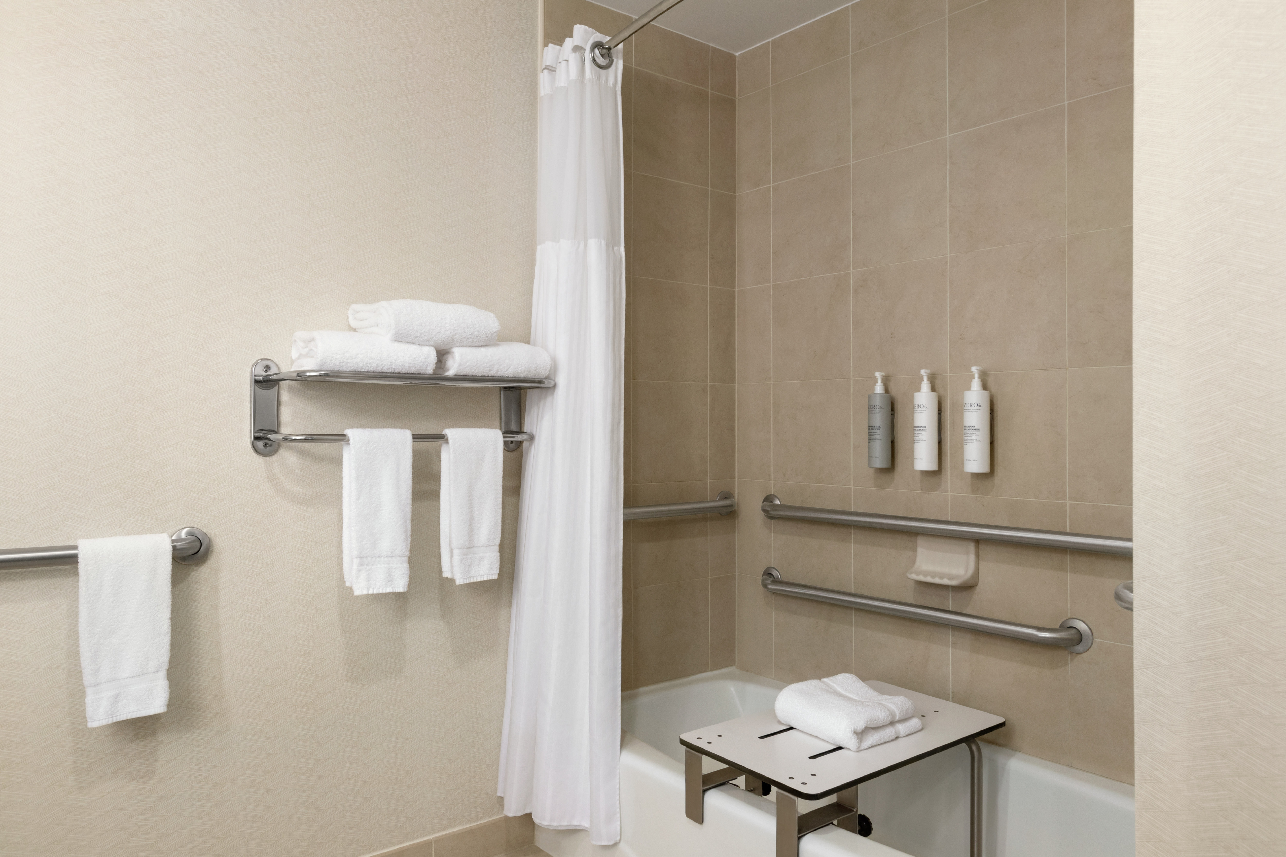 Guest room bathroom with a convenient accessible bathtub