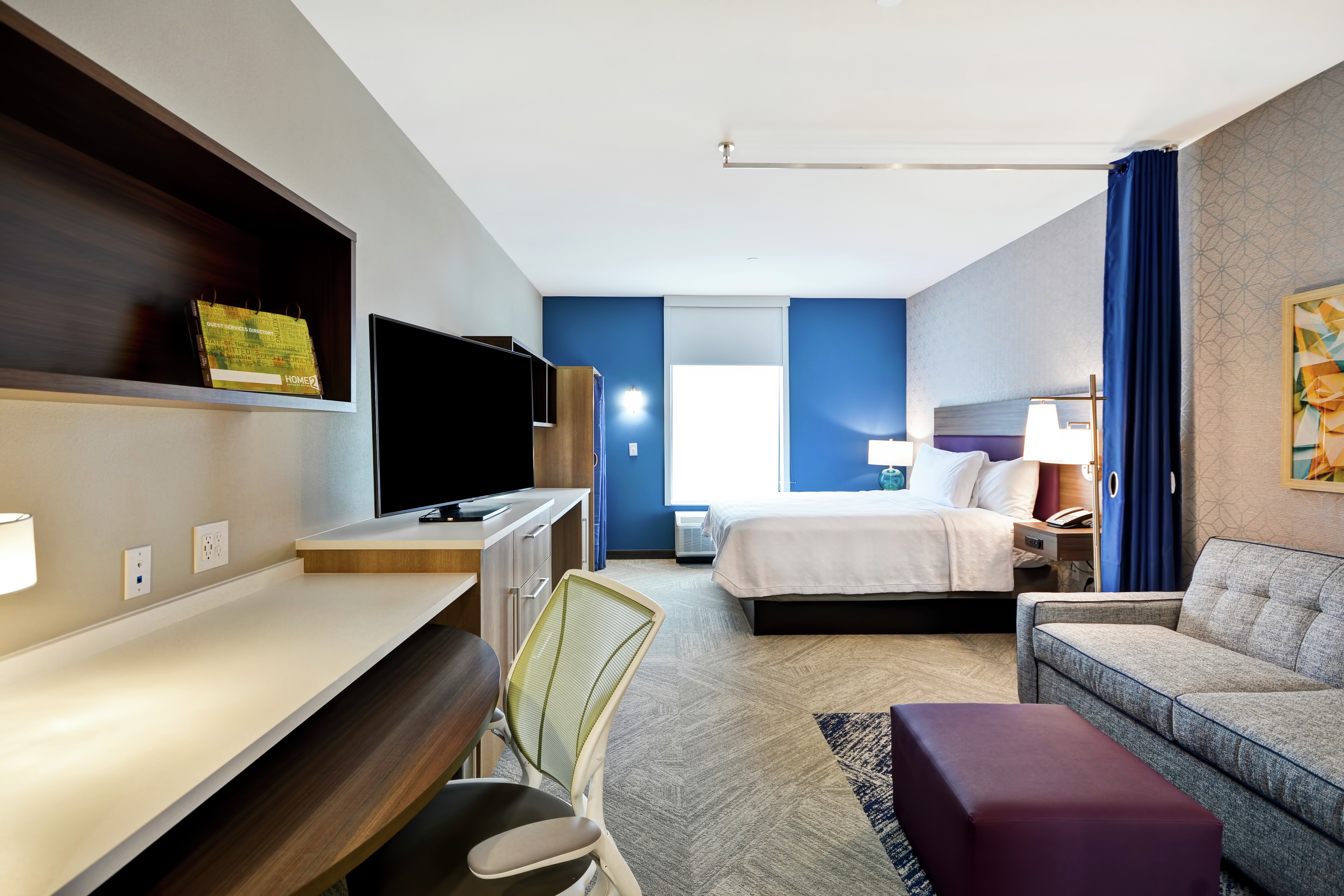 King Studio Suite with Bed, Room Technology, Lounge Area, and Work Desk