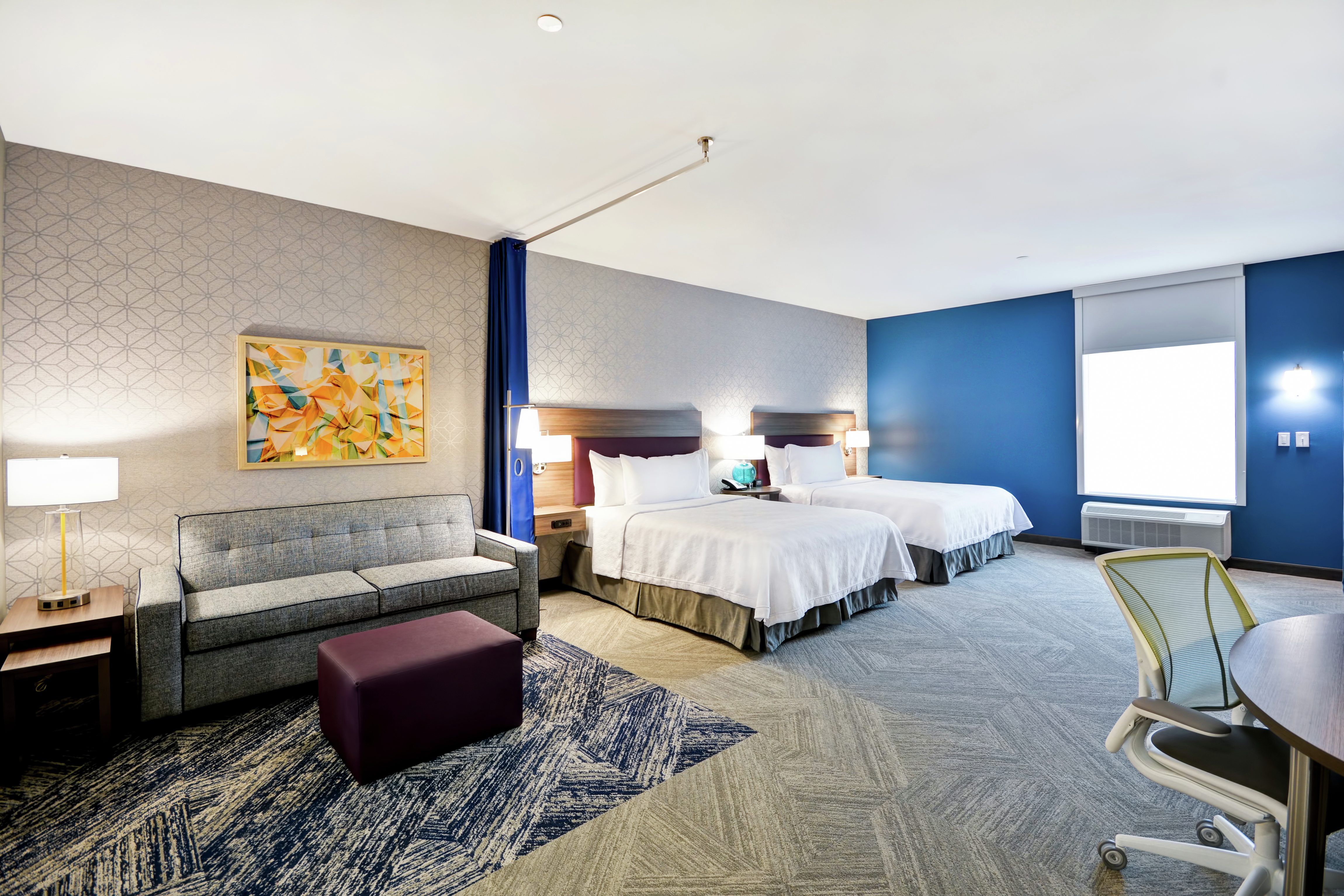 Accessible Queen Guestroom Suite with Two Beds, Work Desk, and Lounge Area