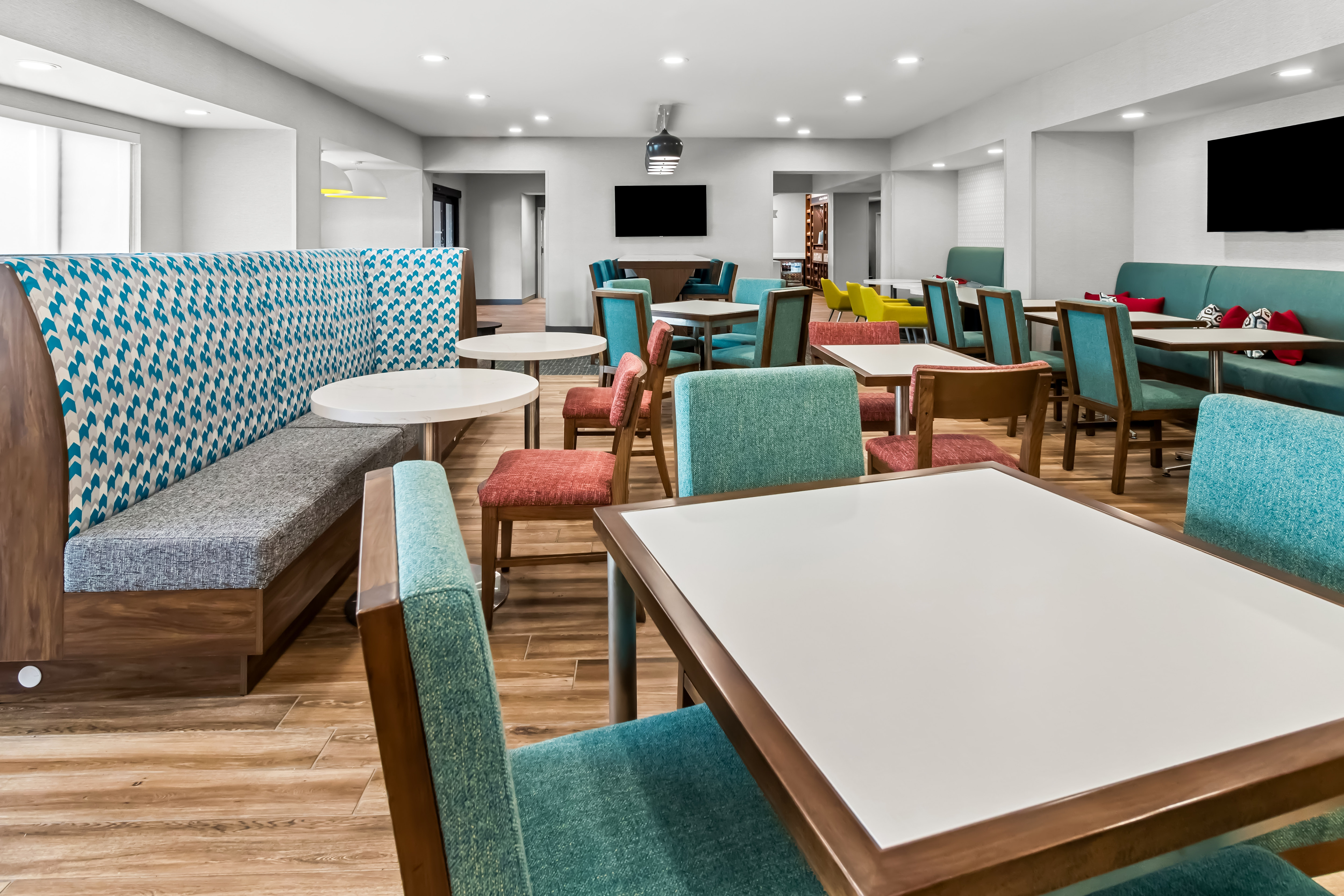 breakfast seating area with many tables