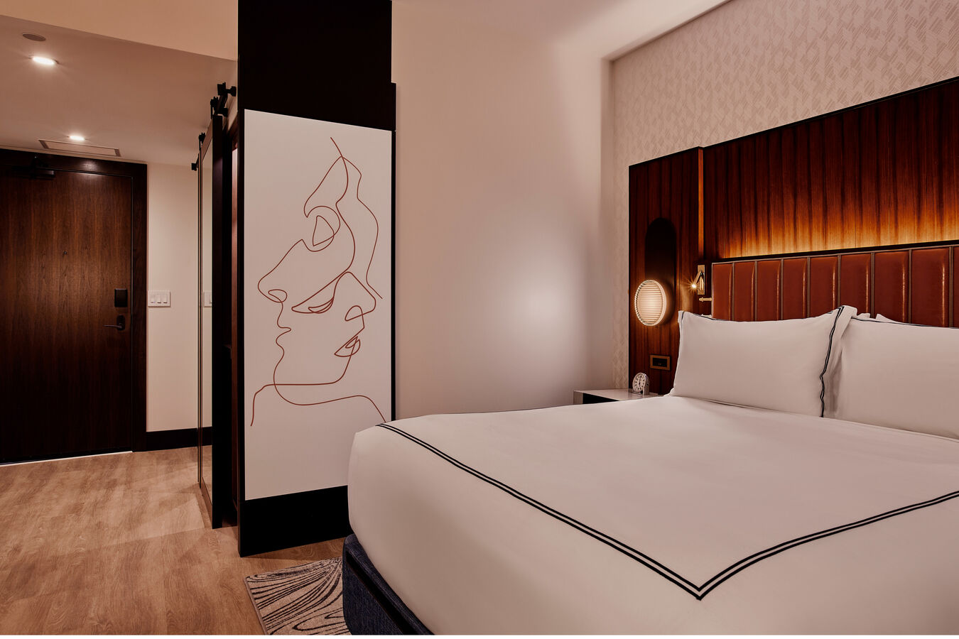 King bedroom with artwork on wall