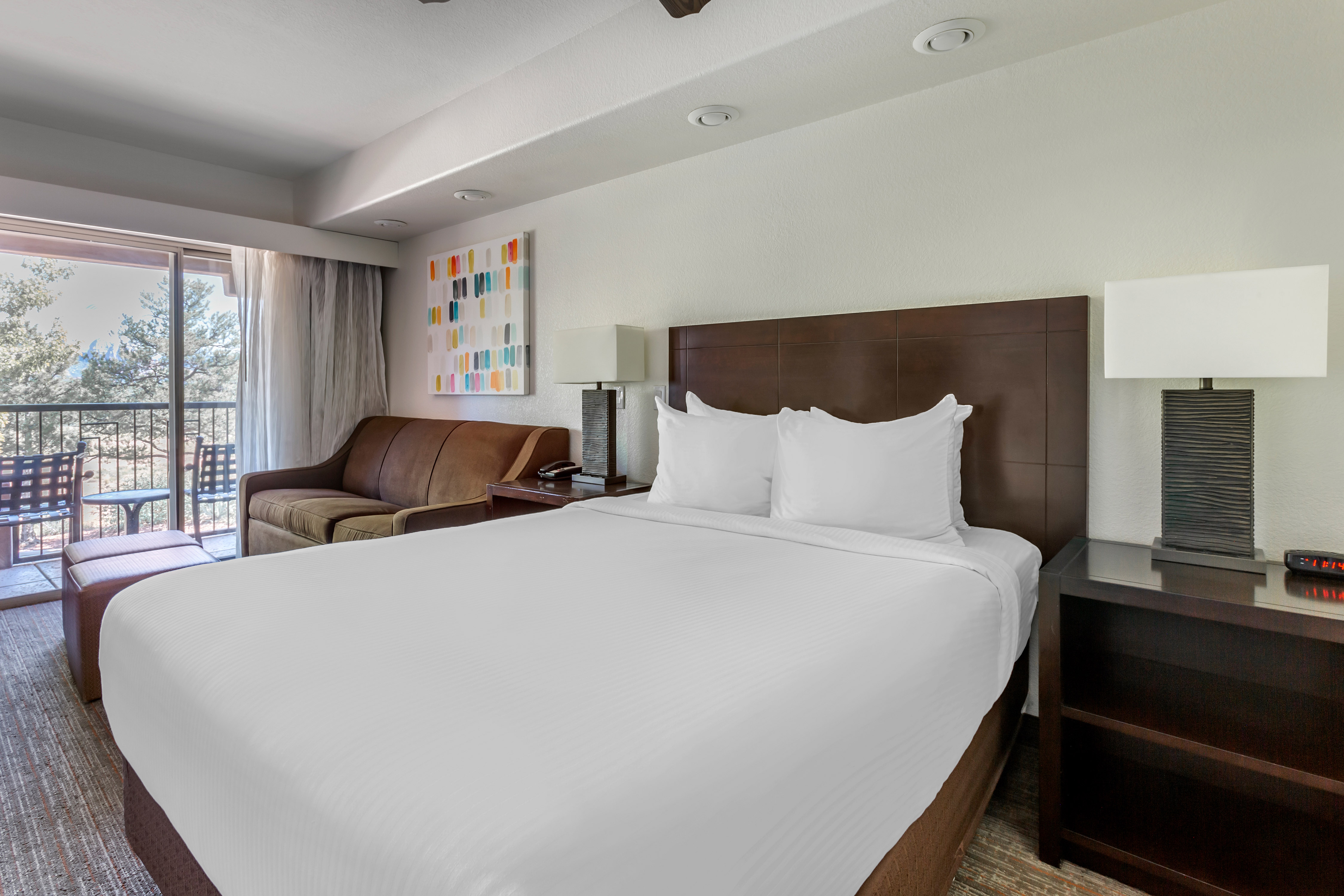 Suite Bedroom with a Large Bed, Sofa and Balcony