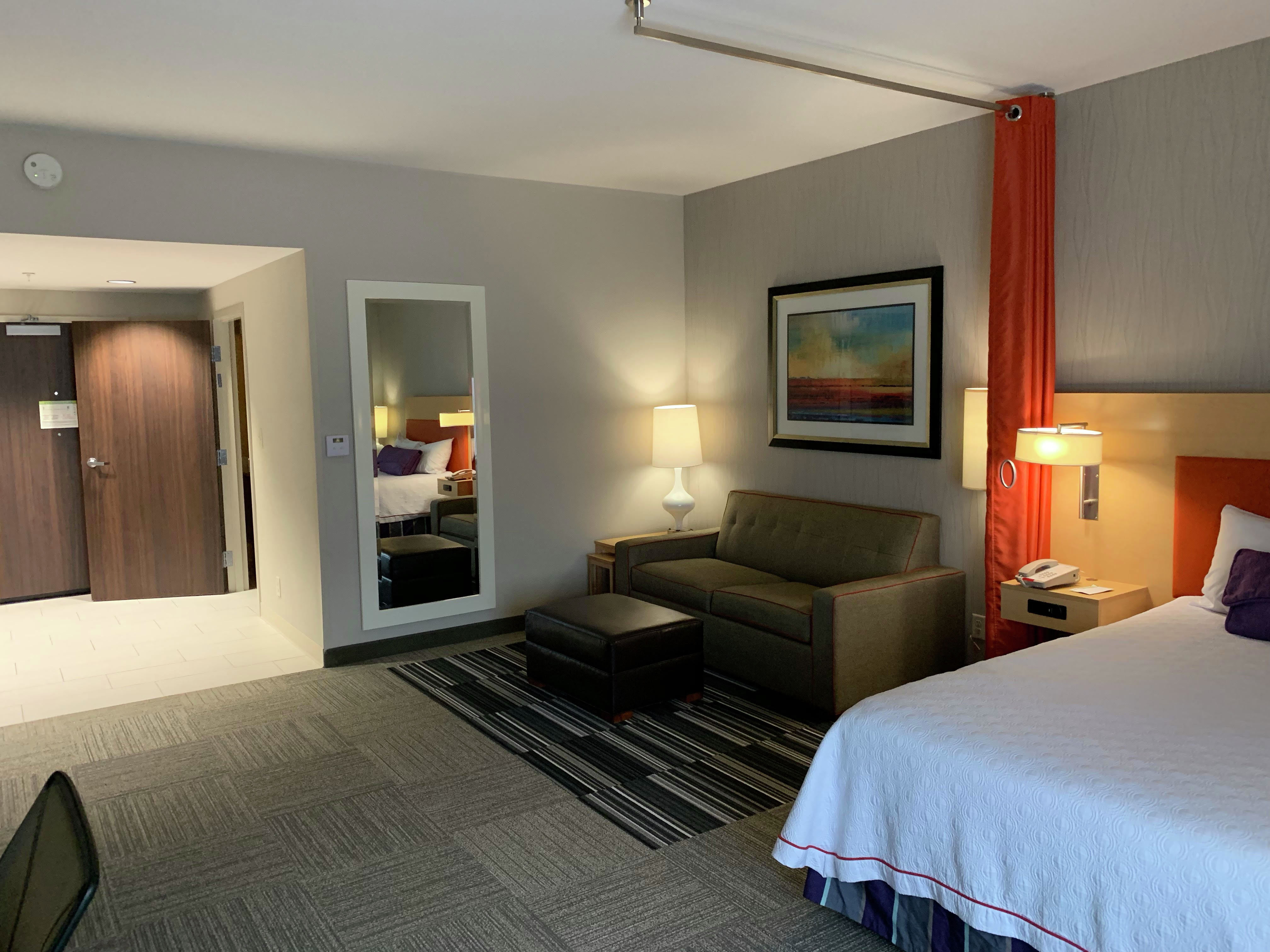 Mobile and Hearing Accessible Guest Room with Queen Bed and Sofa