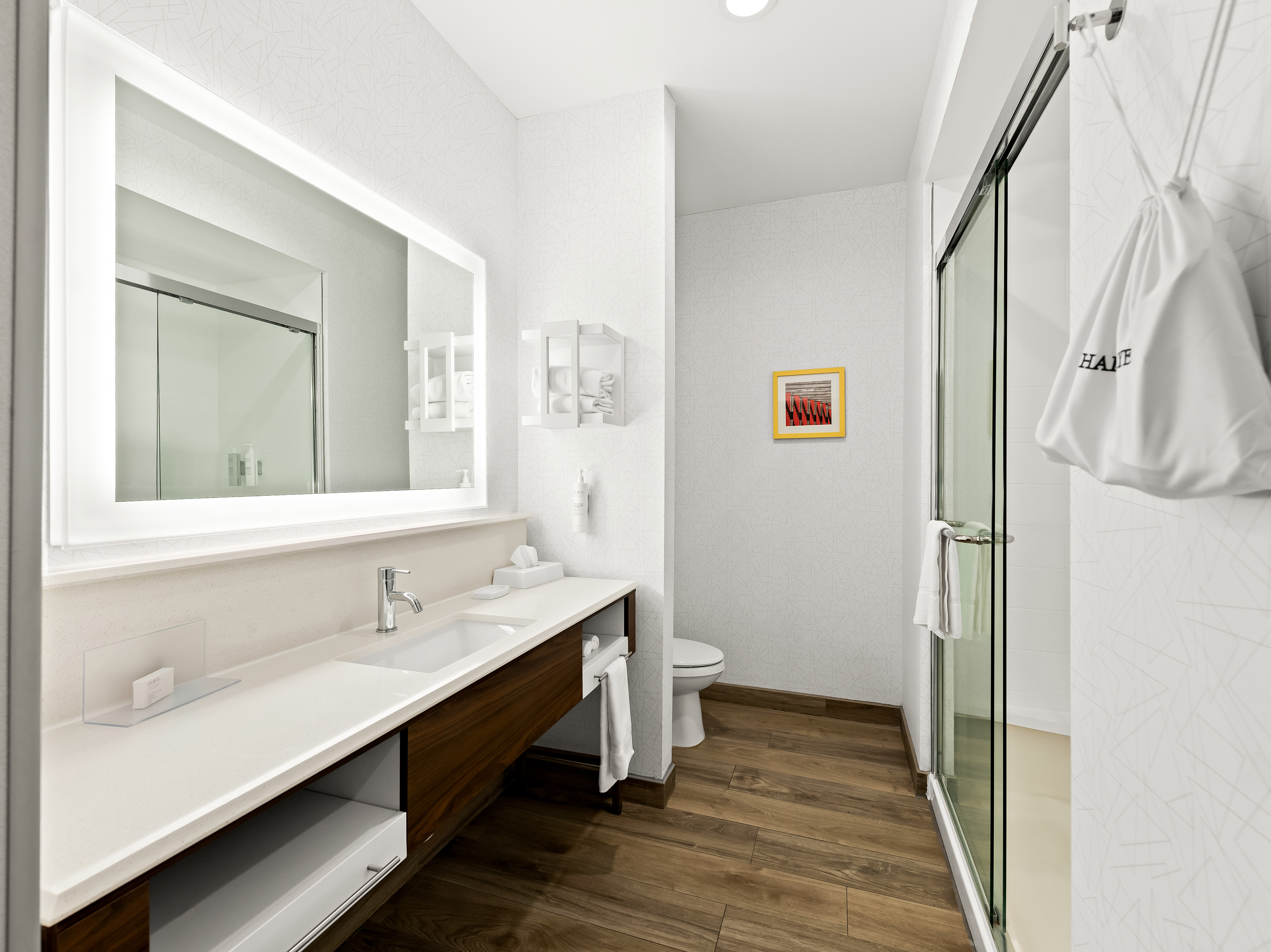 King bathroom with sink mirror and shower