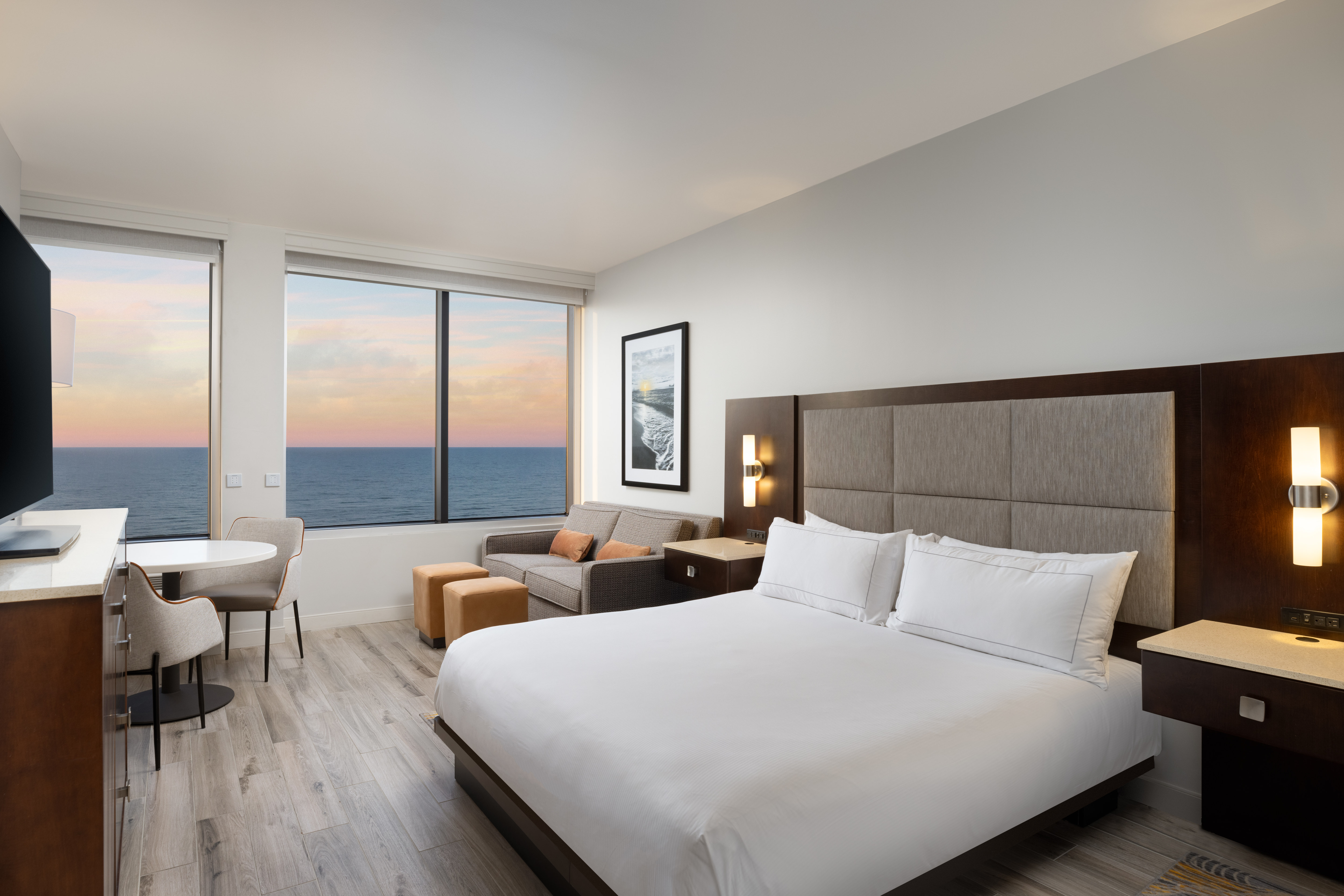 Accessible premium king oom with sofabed and large picture windows providing a view of the Gulf