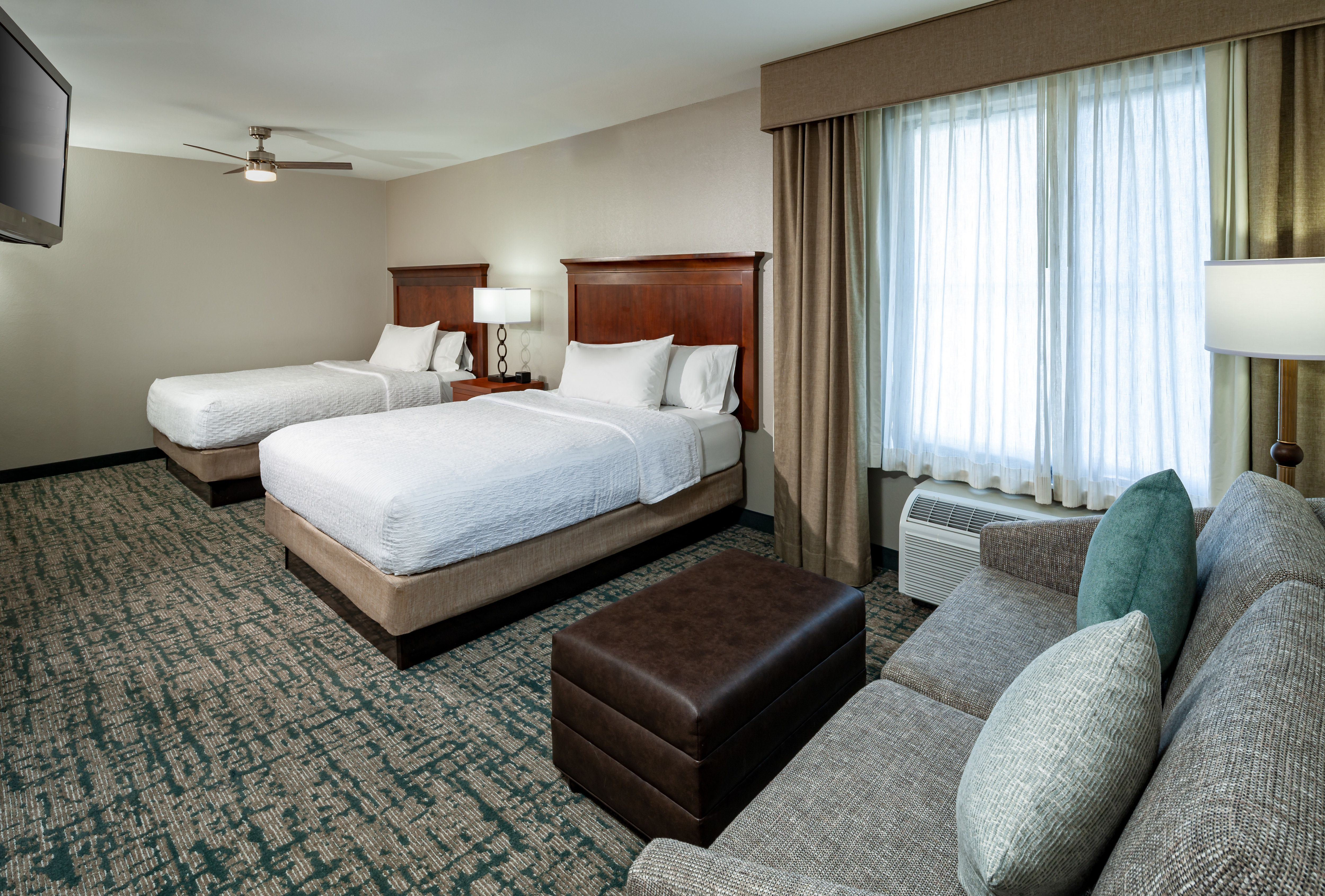 two queen beds and sofa