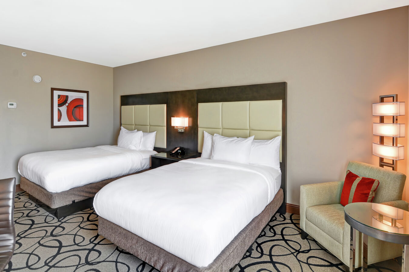 Two Queen Beds and Lounge Chair in Guest Room