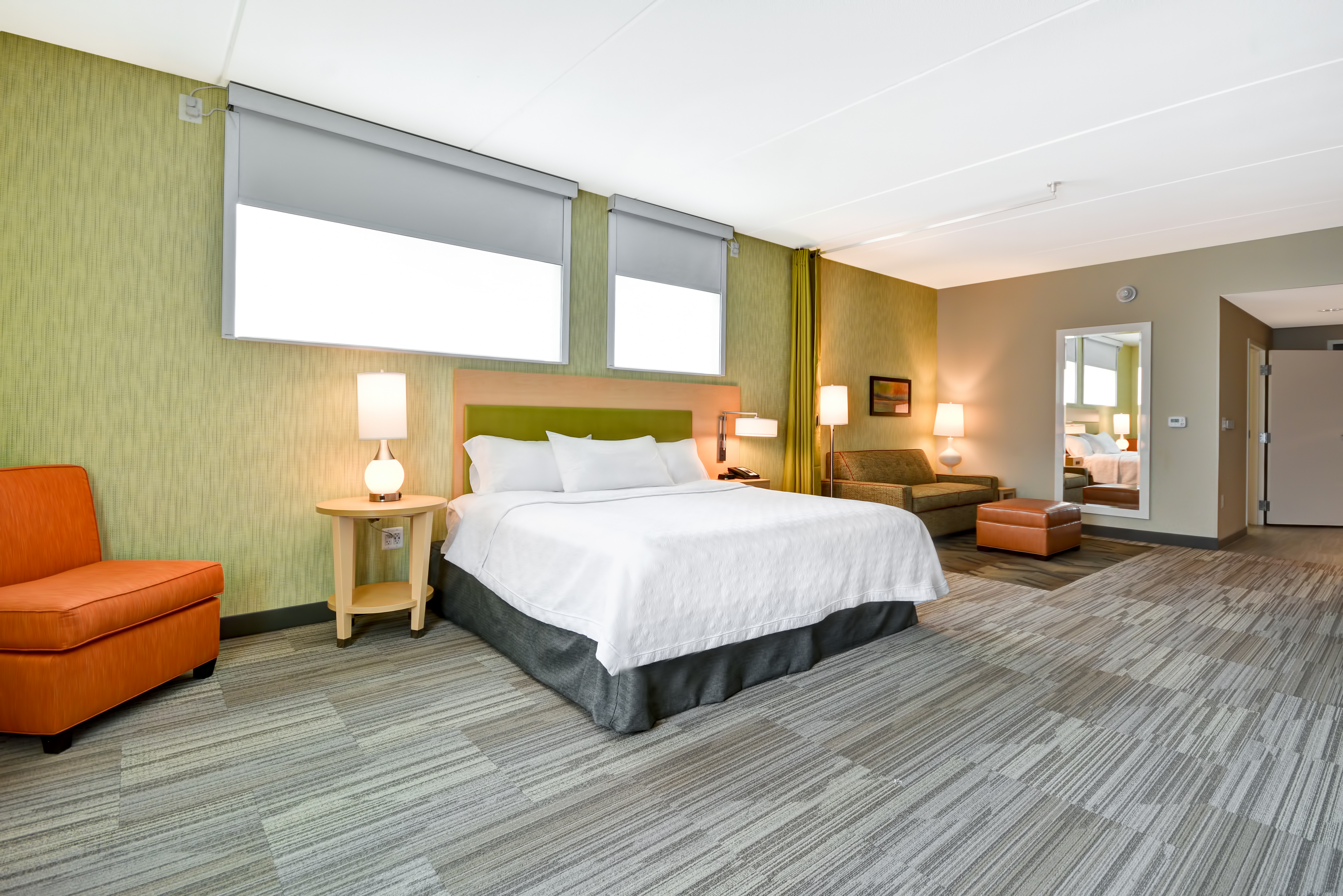 One King Bed Guestroom Lounge Area with Armchair, Sofa and Footrest