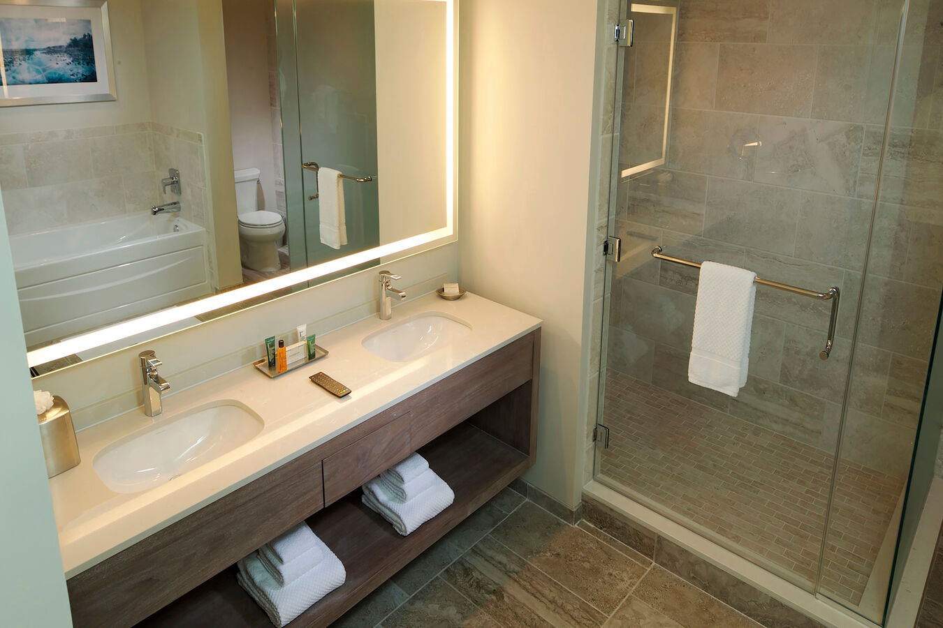 Marble bathroom with two sinks and spacious shower