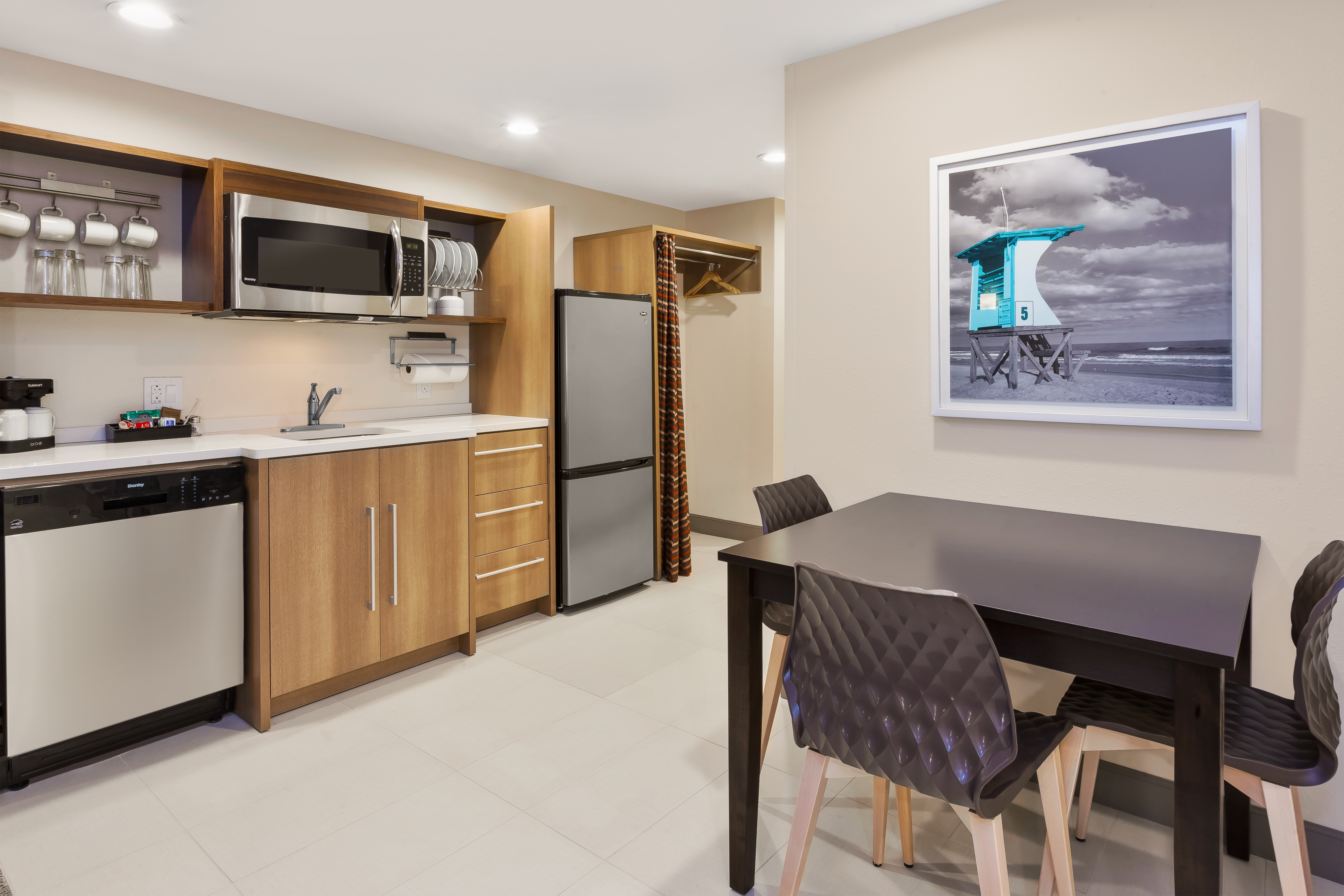 Kitchen with microwave and refrigerator