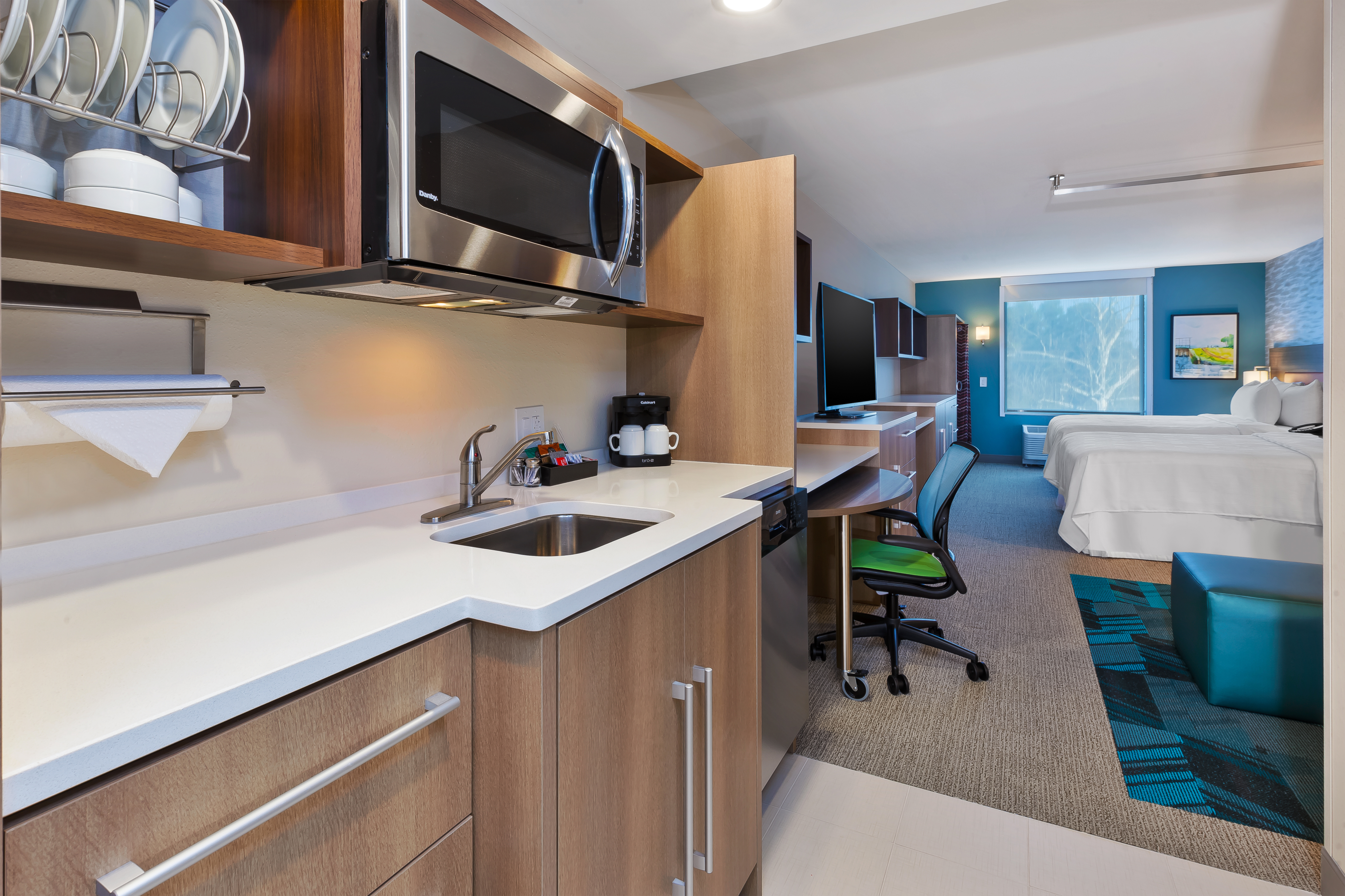 Kitchen with microwave and refrigerator