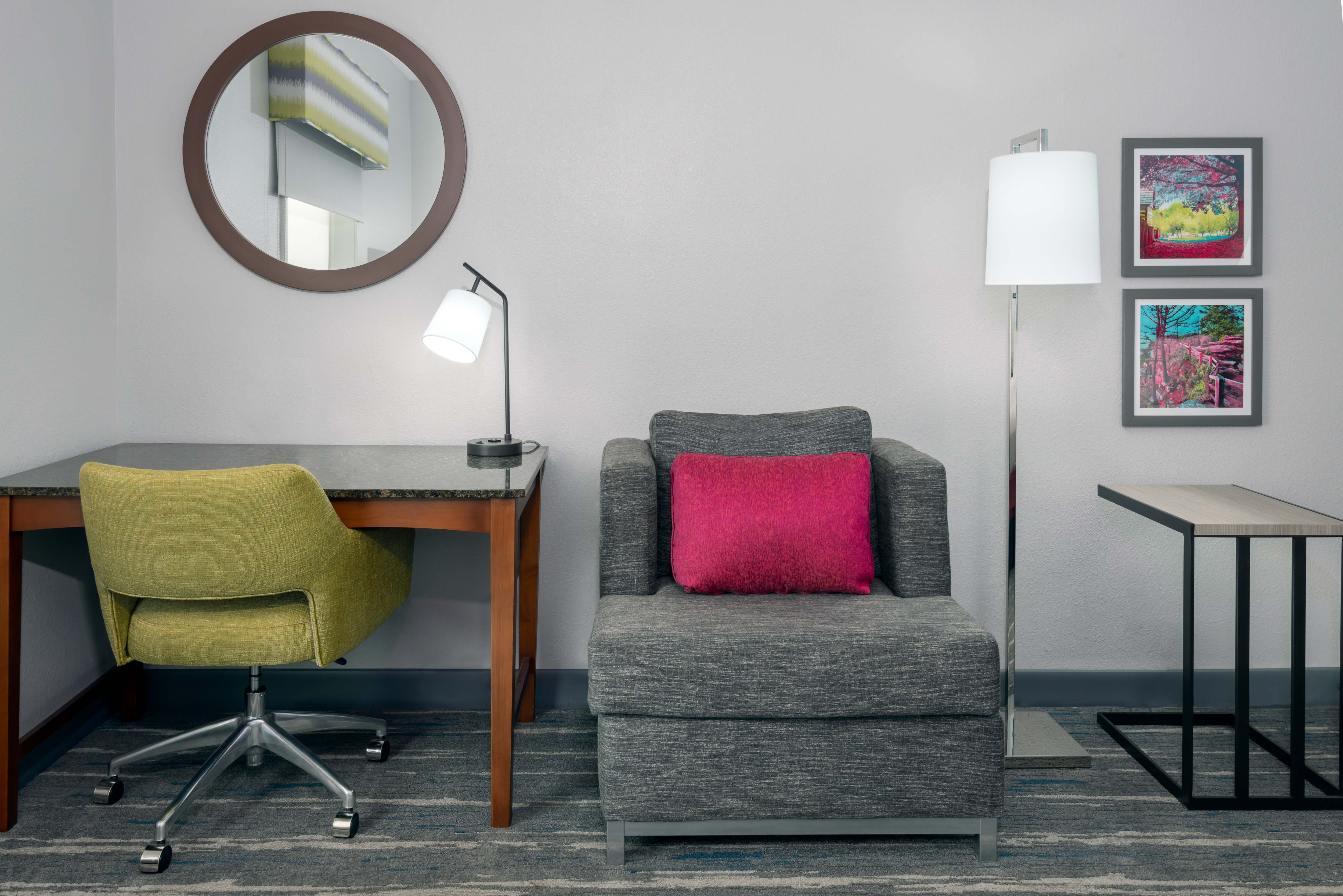 Desk with Mirror and Soft Armchair in Hotel Guest Room