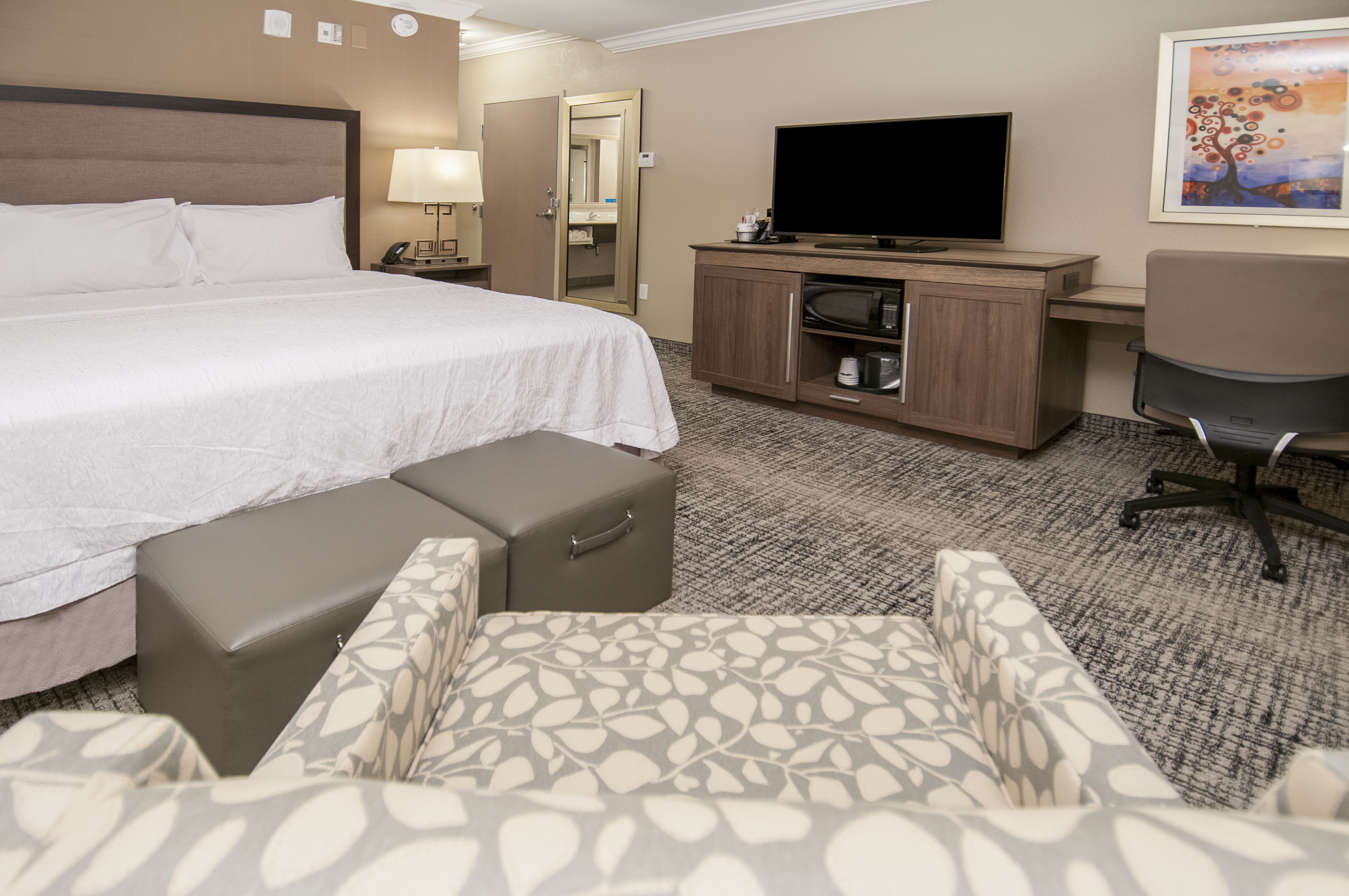 Guest Room with Large Bed Desk HDTV and Microwave