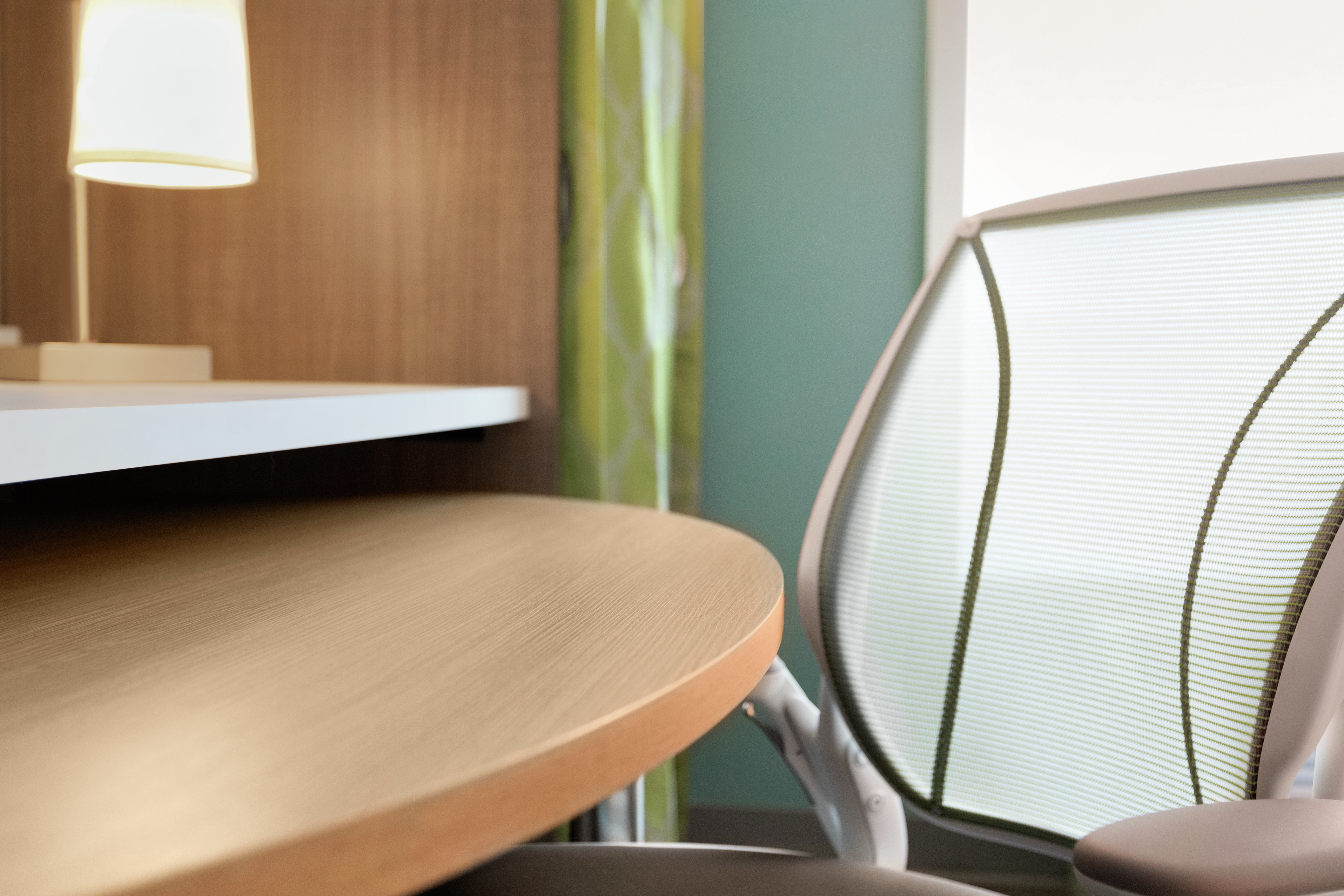 Detail of work desk and ergonomic chair that has been made of recycled materials.