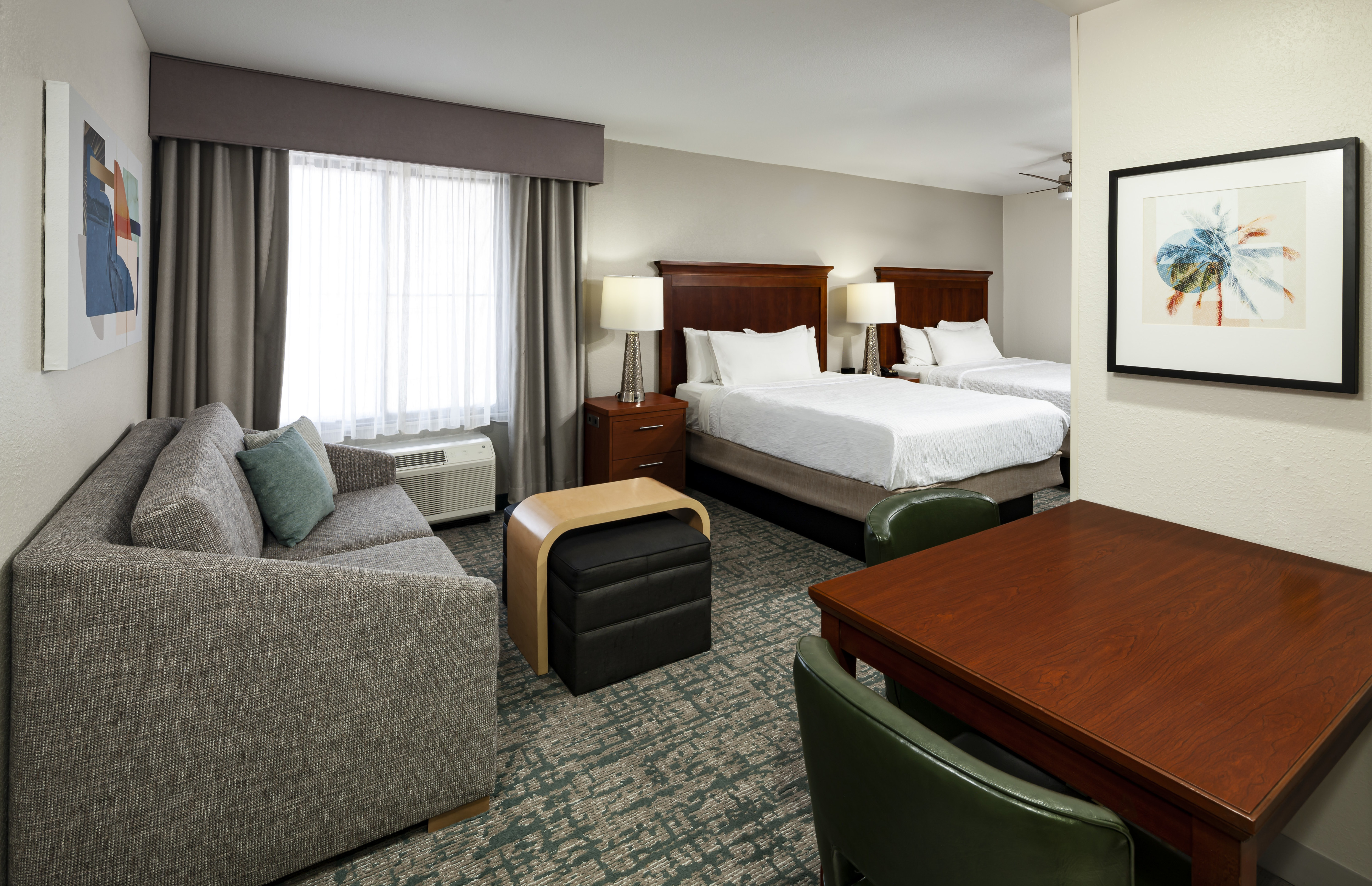 studio suite, sofa, table, 2 queen beds