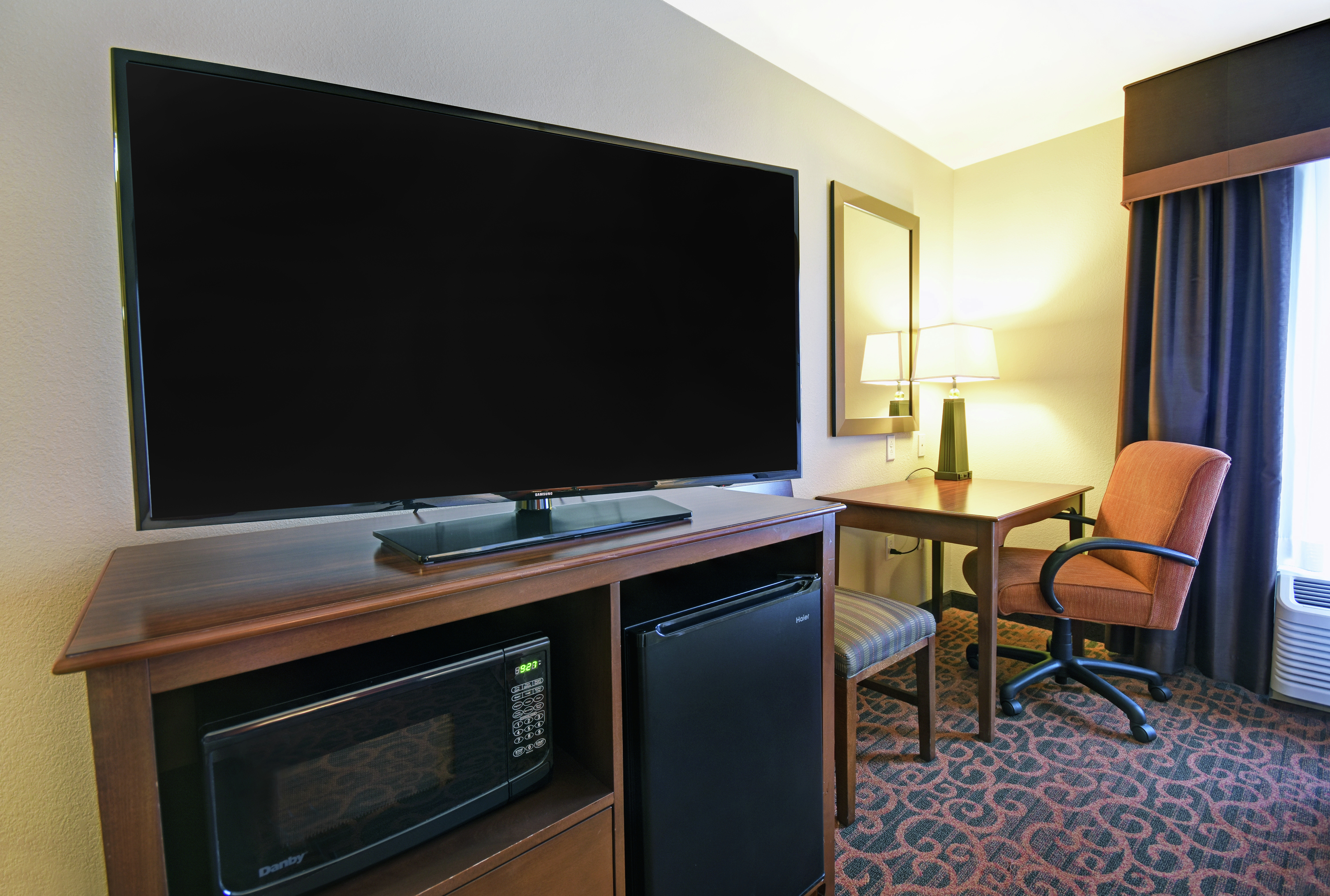 Guestroom with Work Desk, Television, Microwave and Mini Fridge