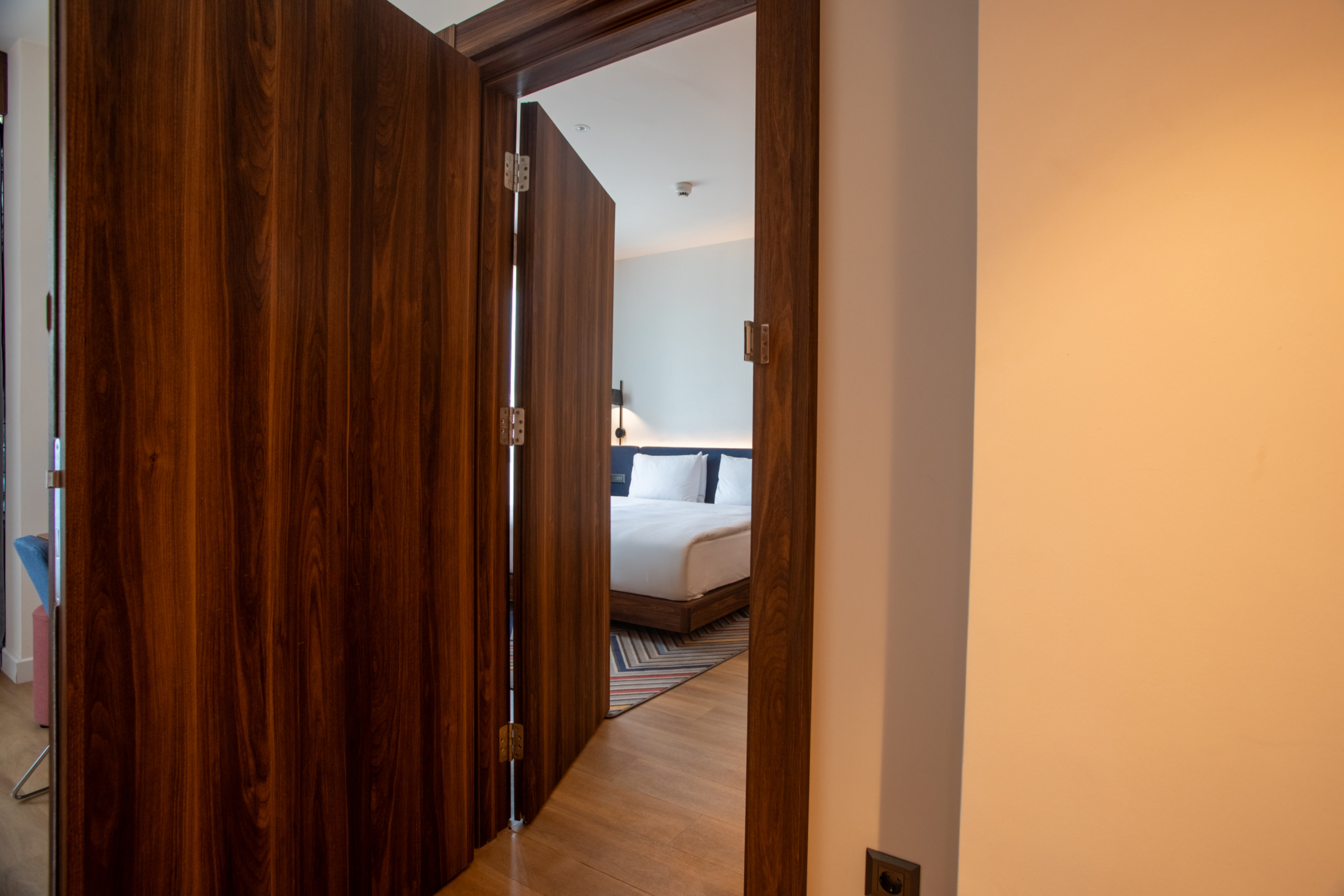 Open door from living area to bedroom.