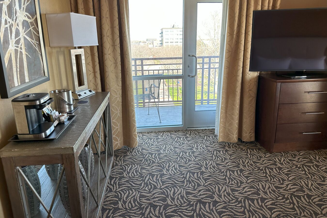 Coffeemaker, TV and Balcony in a Hotel Suite