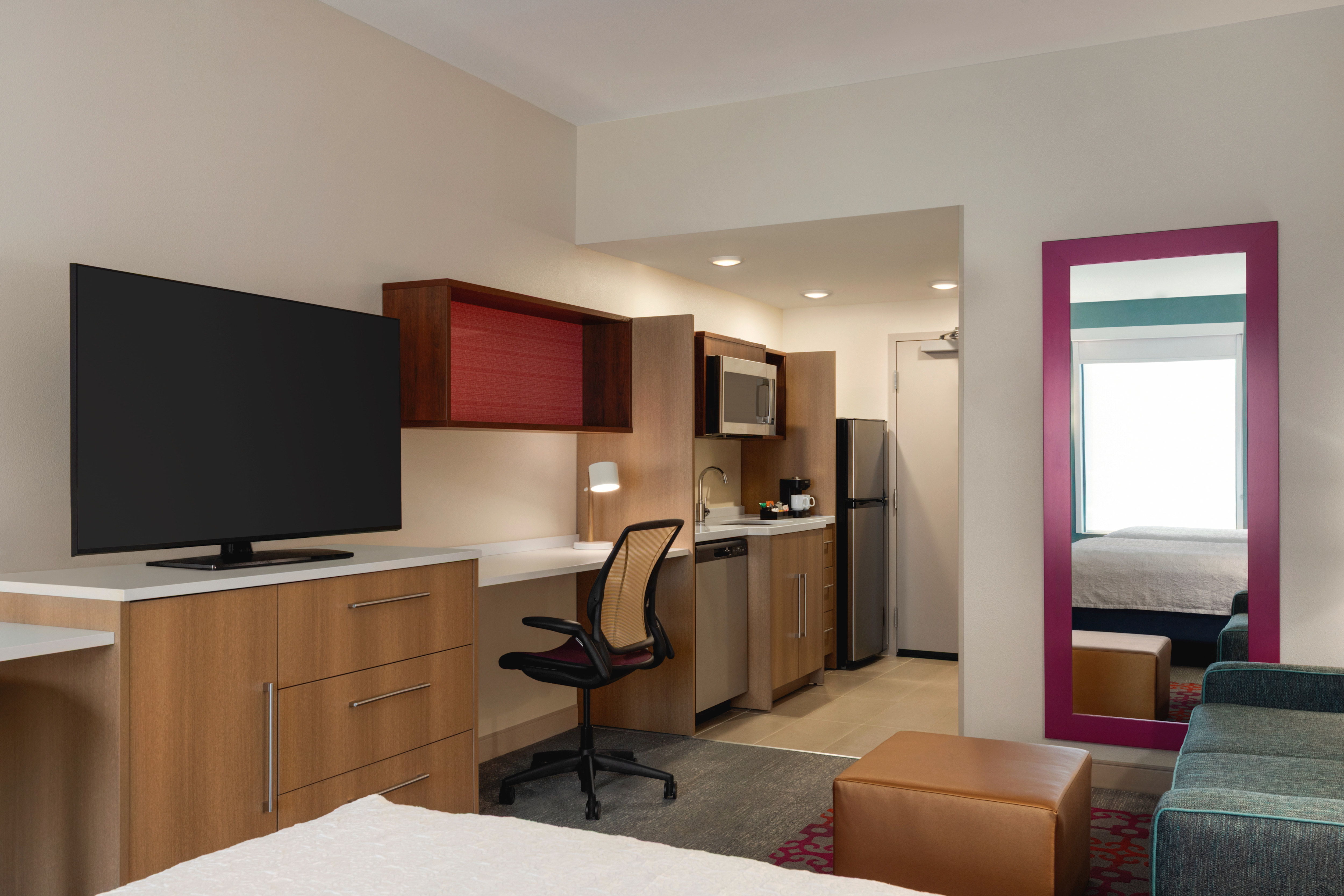 Spacious suite with a flat screen tv and work desk
