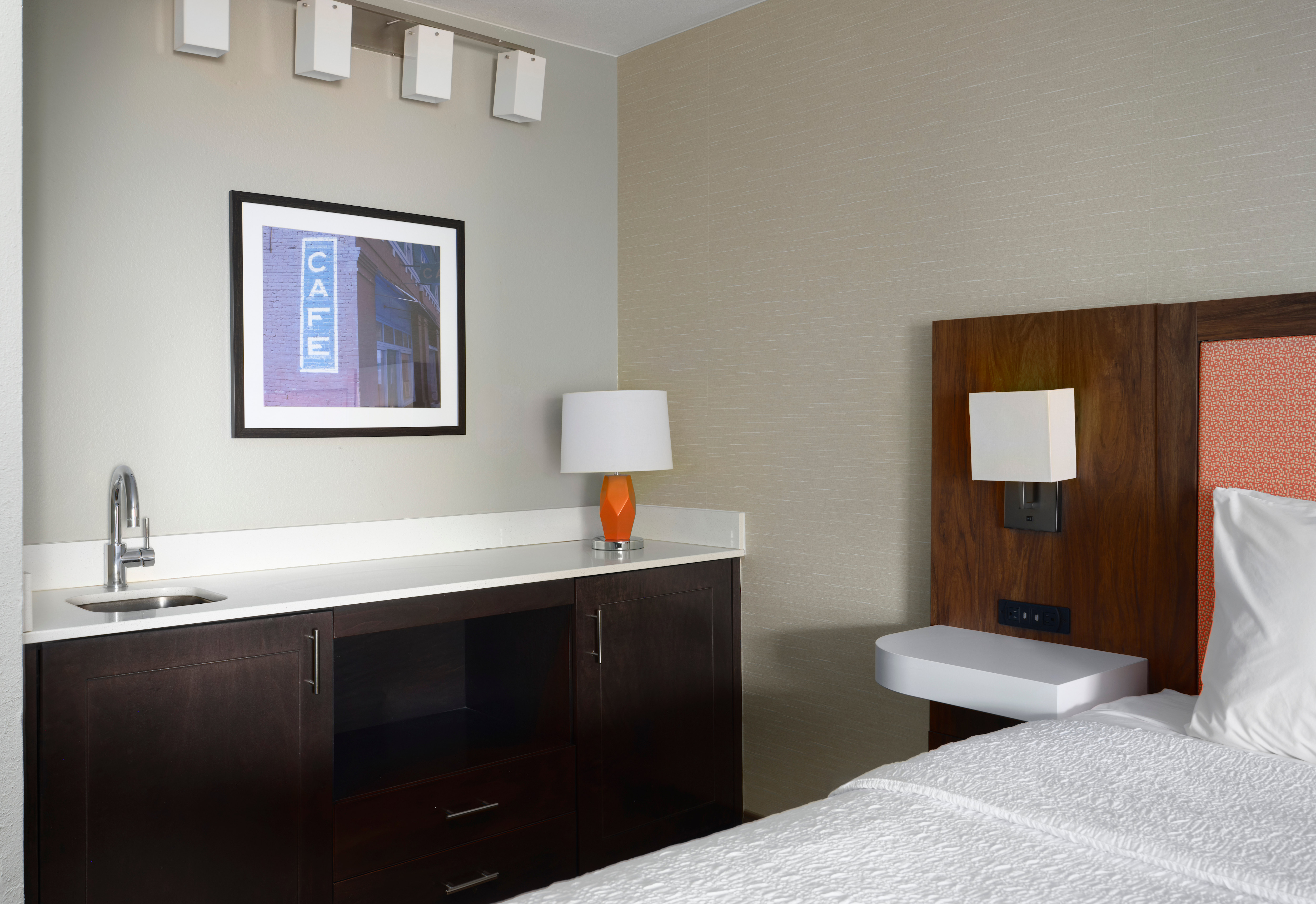 Wet Bar and Bed in a Guest Room