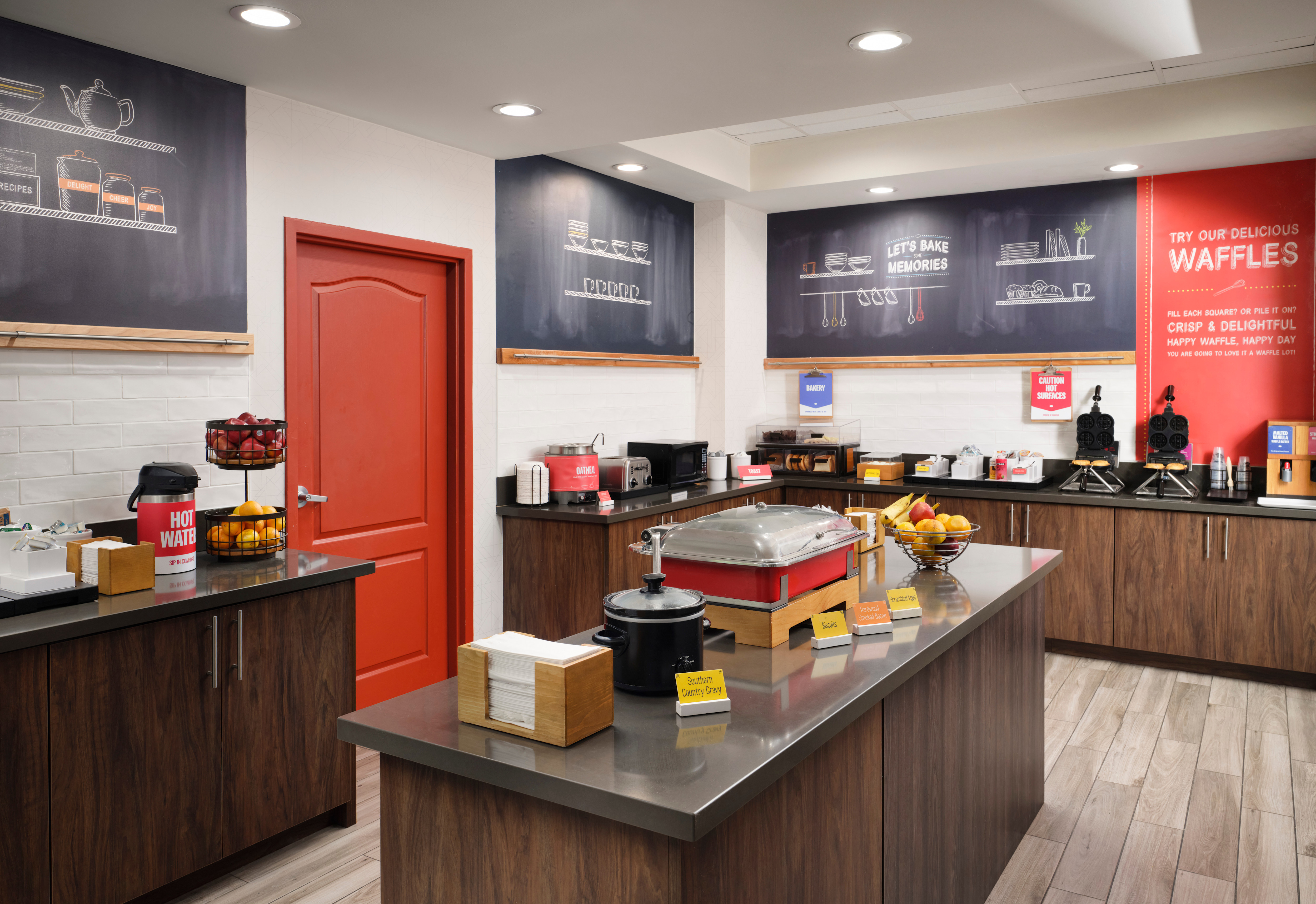 Breakfast Area with Fresh Fruits, Coffee, Waffle Makers and Hot Foods