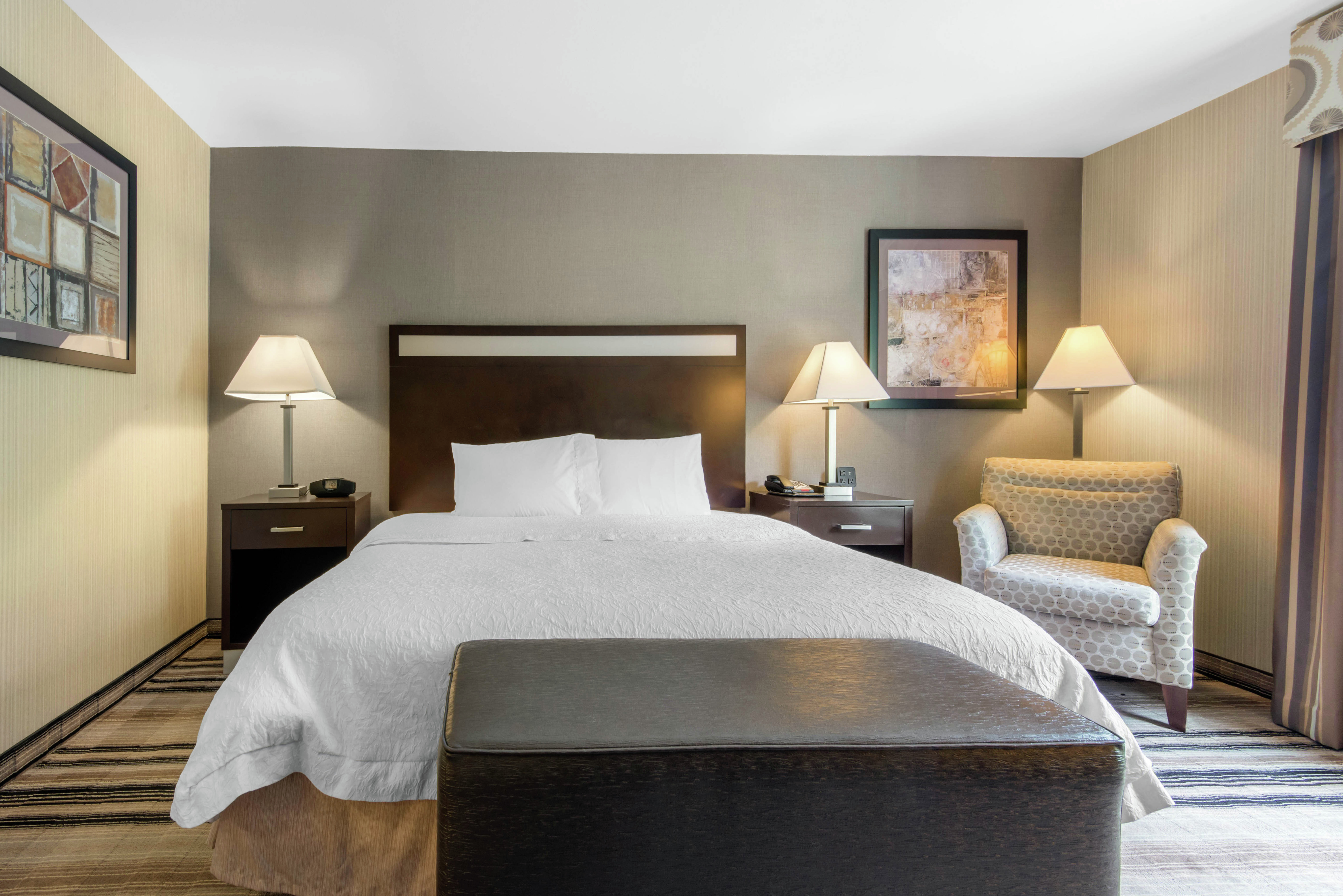 One King Mobility and Hearing Accessible Guest Room with Soft Armchair
