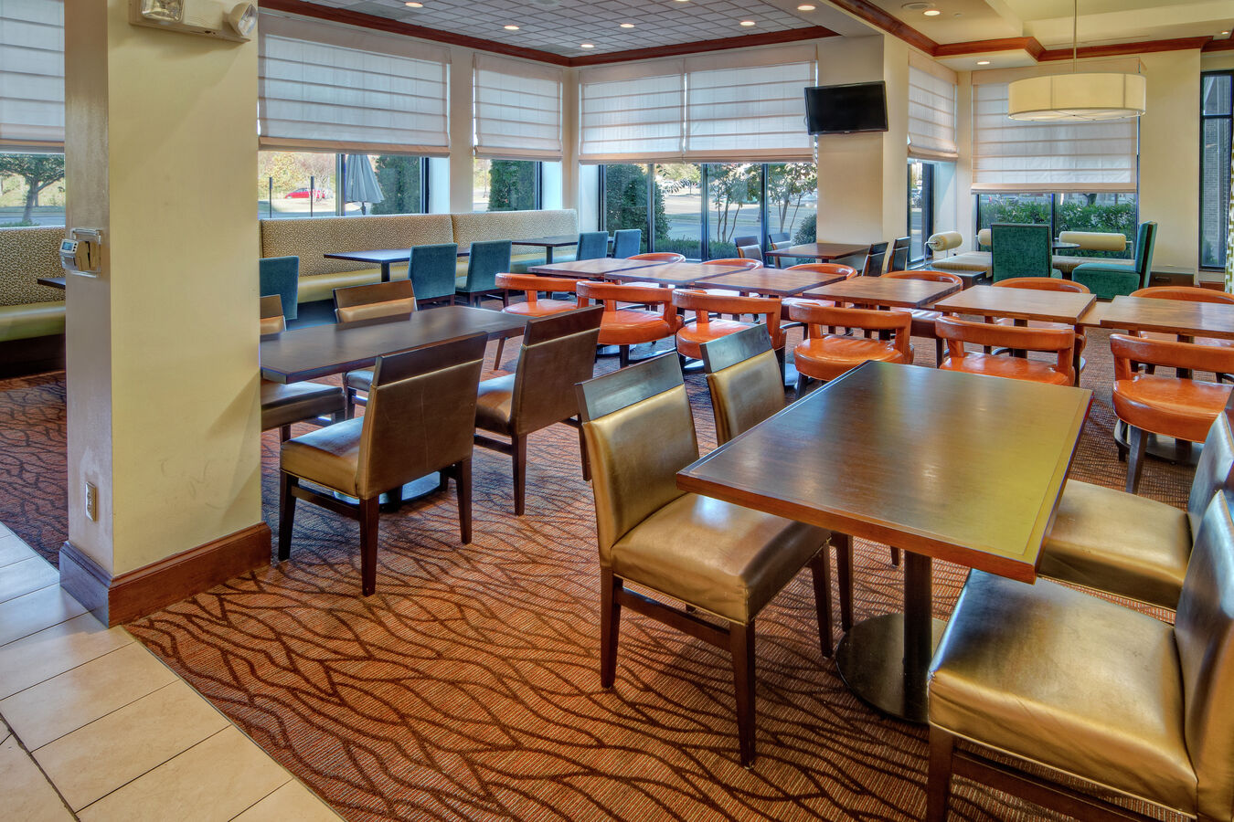 Tables, Chairs and TV in Restaurant Dining Area
