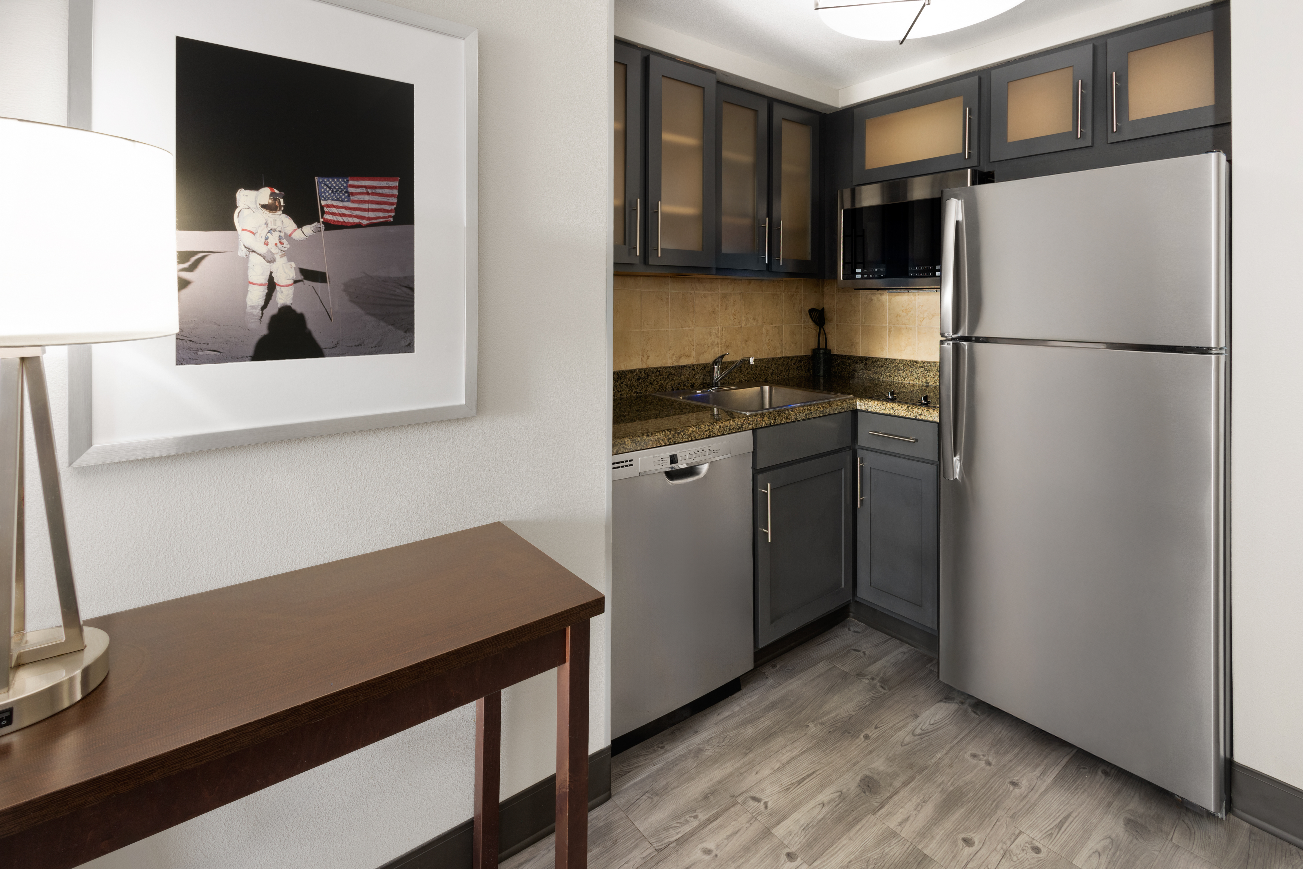 Enjoy the fully equipped kitchen which includes a full-sized refrigerator, microwave, dishwasher, twin burner cooktop and utensils