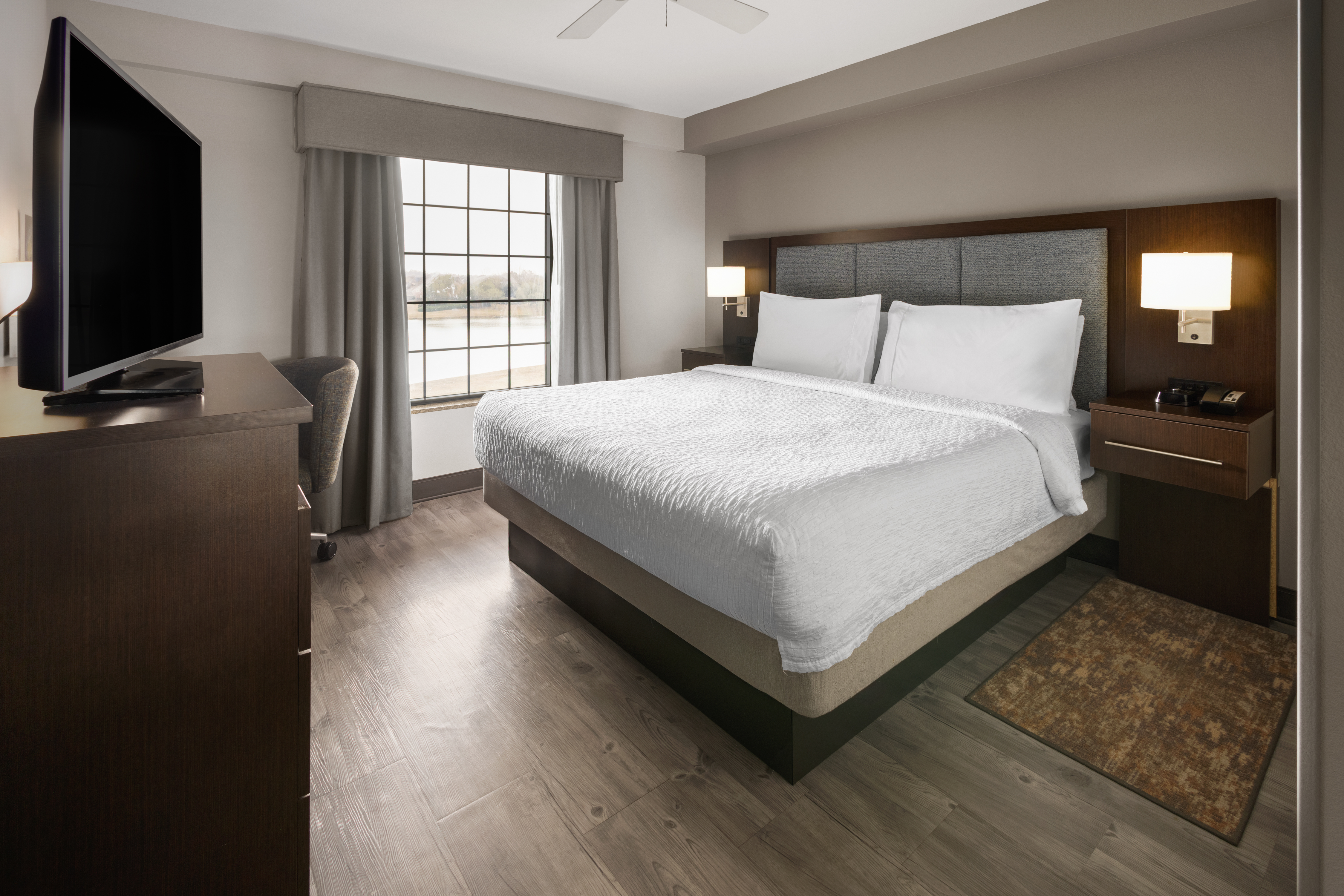 Enjoy a rejuvenating night's sleep in a king-sized bed in the separate bedroom, which includes a second TV