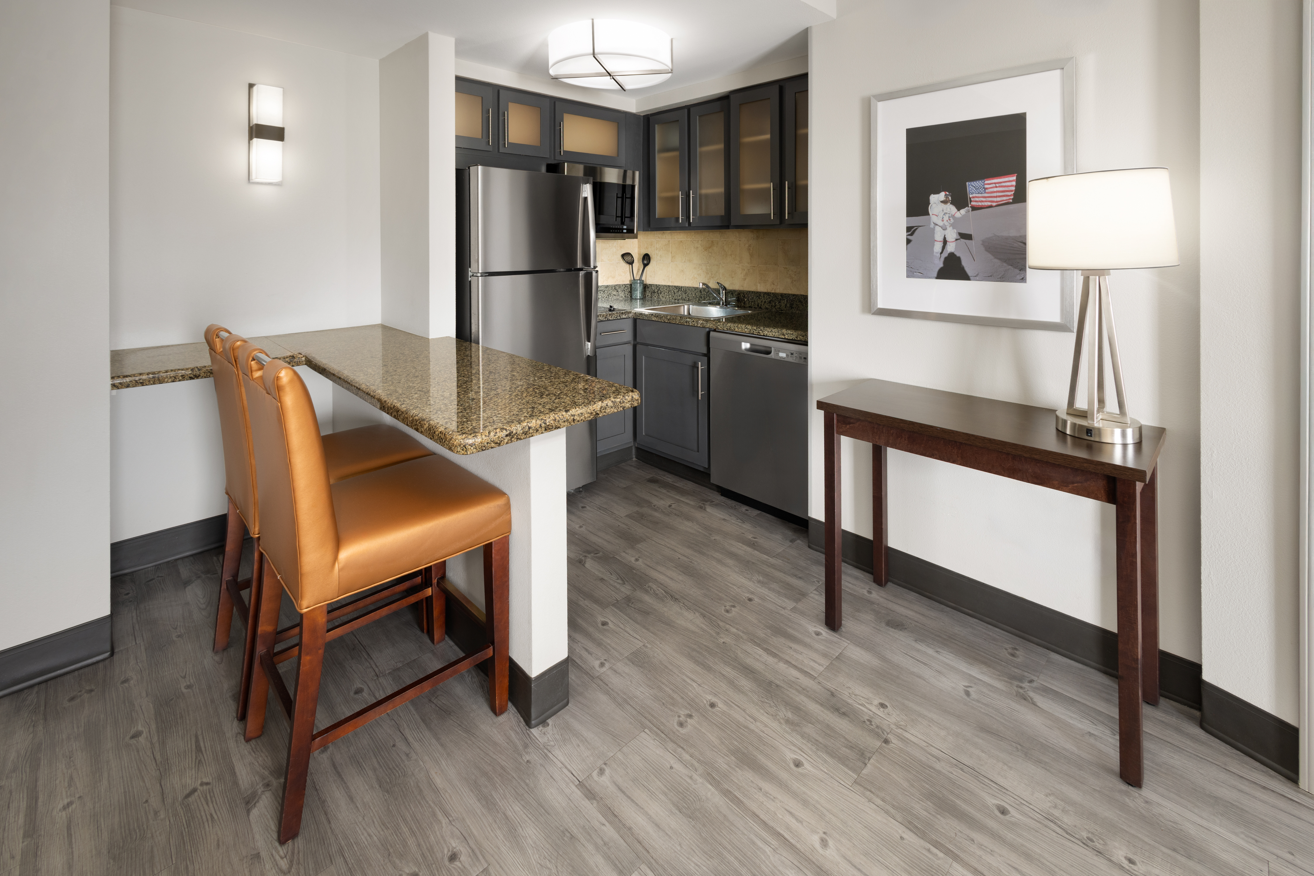 Enjoy the use of a fully equipped kitchen with a full-sized refrigerator, microwave, dishwasher, twin burner cooktop and utensils