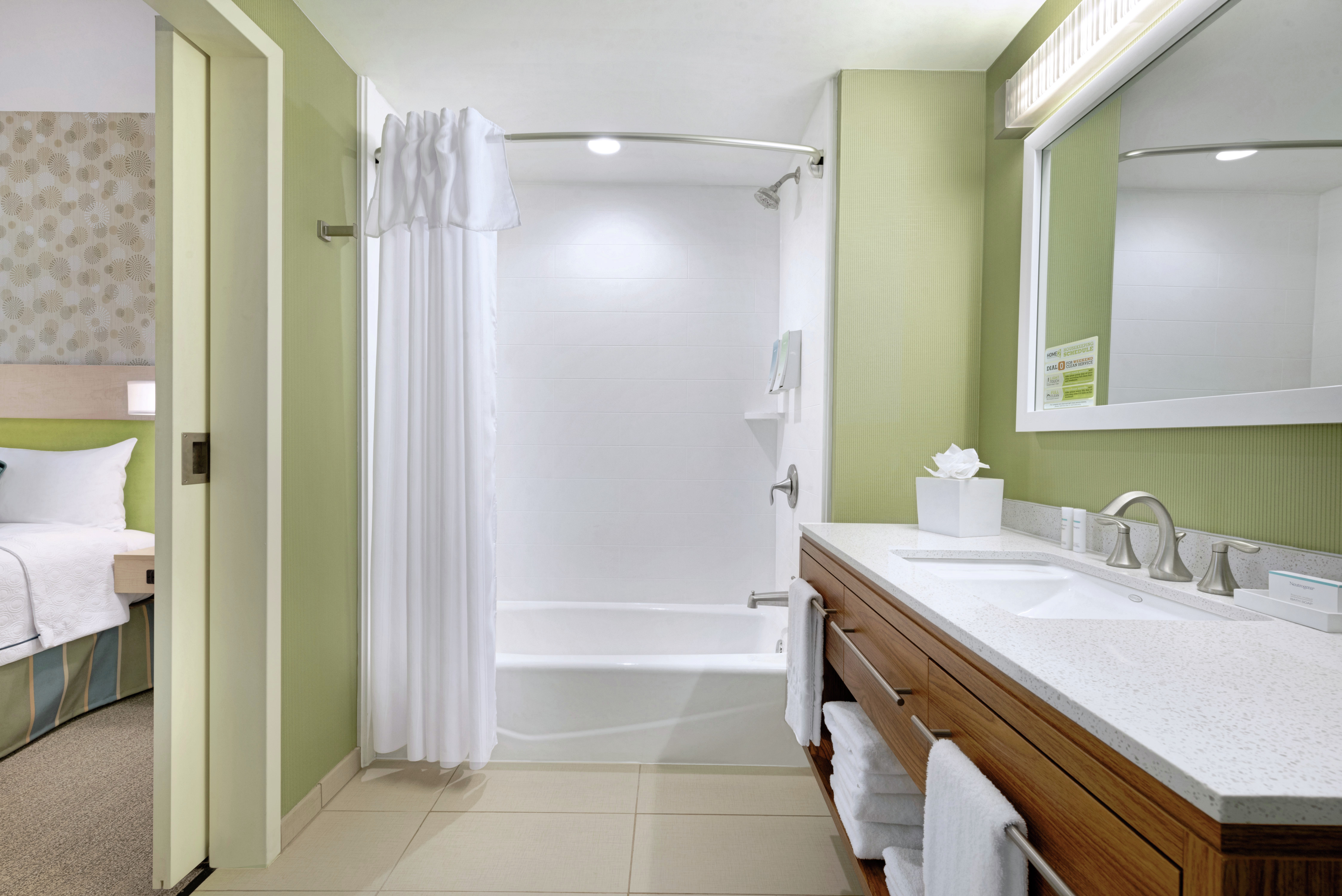 Bathtub, Shower, and Vanity in Suite Bathroom