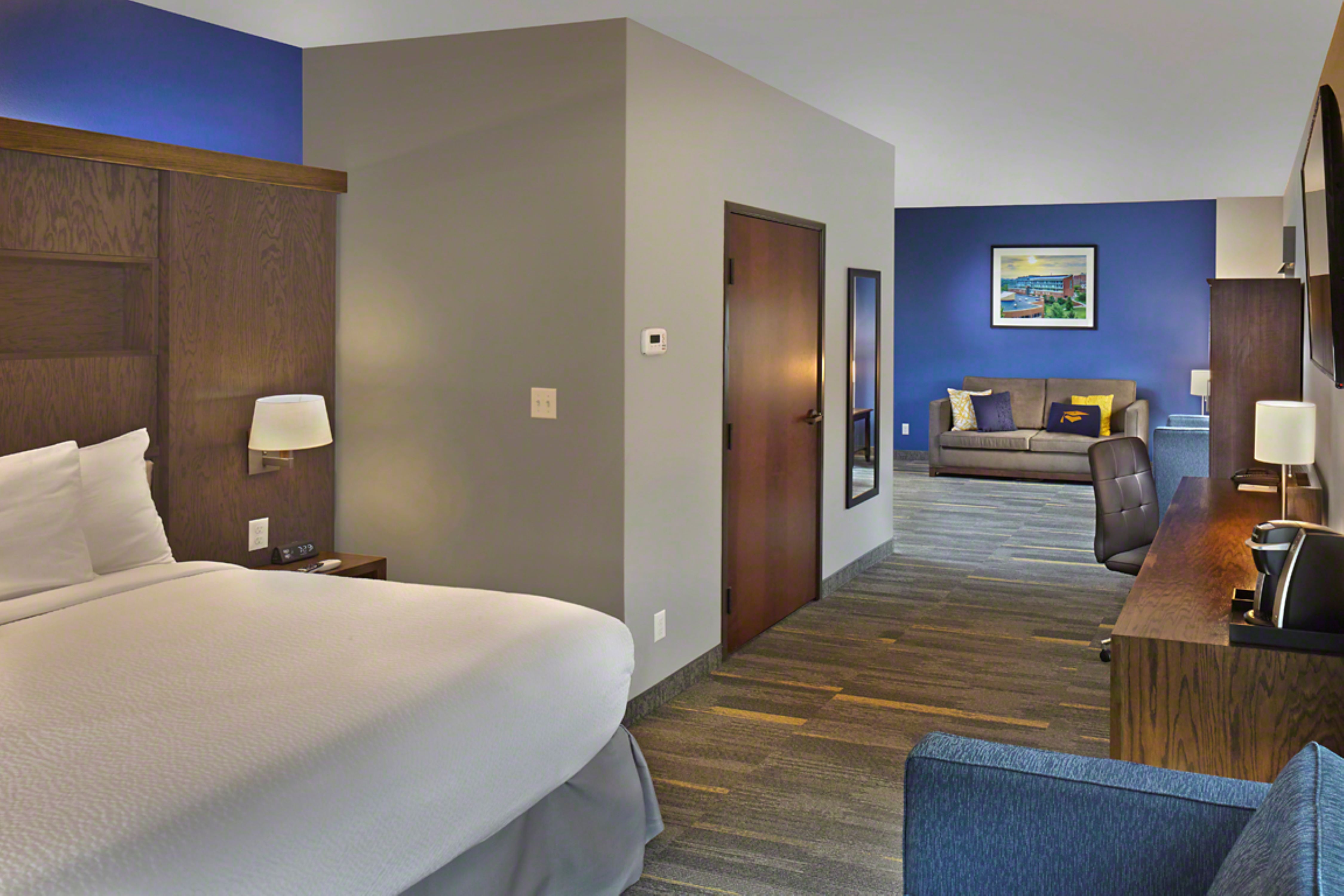 Corner suite bedroom and lounge area