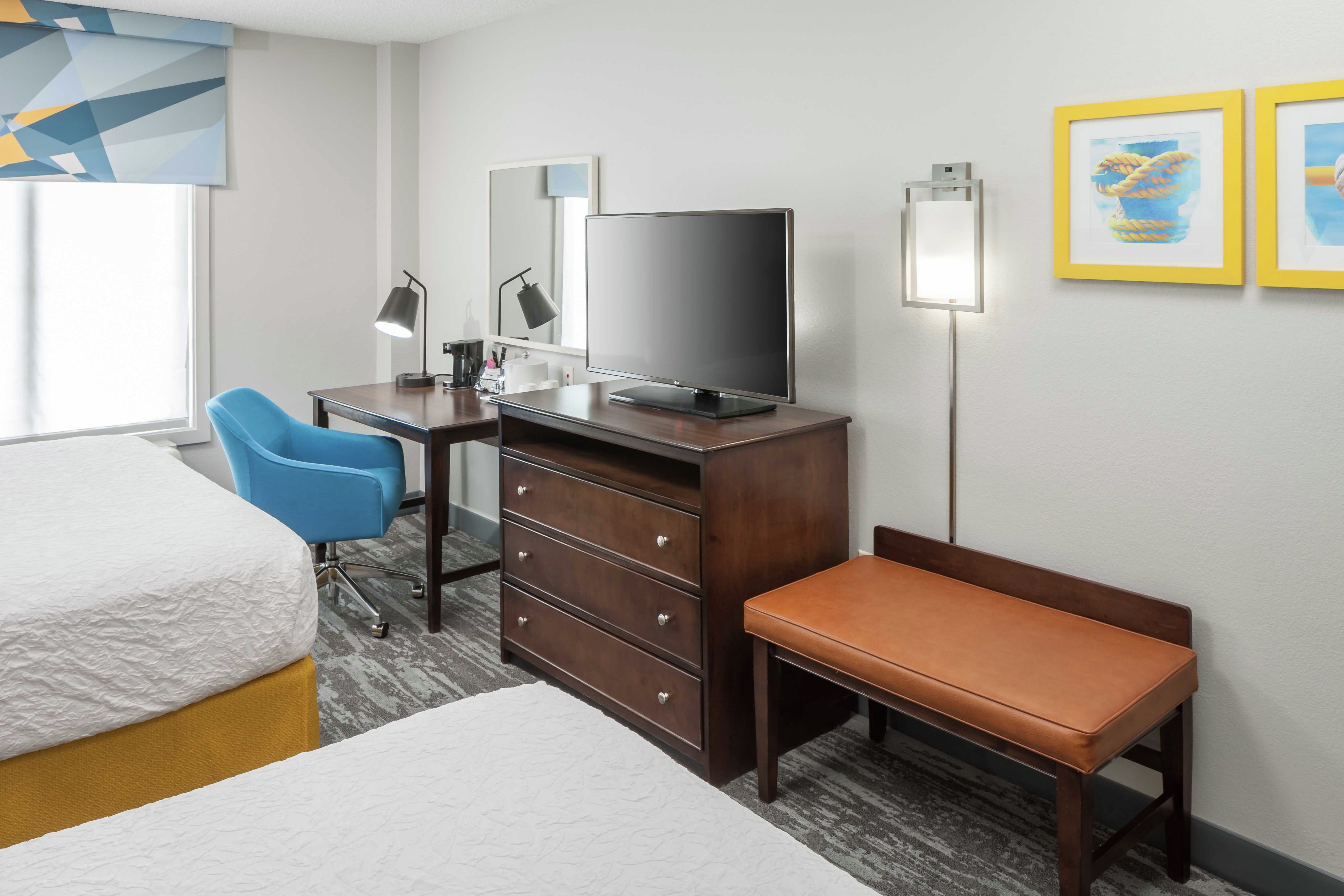 Guestroom with Double Double Beds, Lounge Area, Work Desk, and Room Technology 